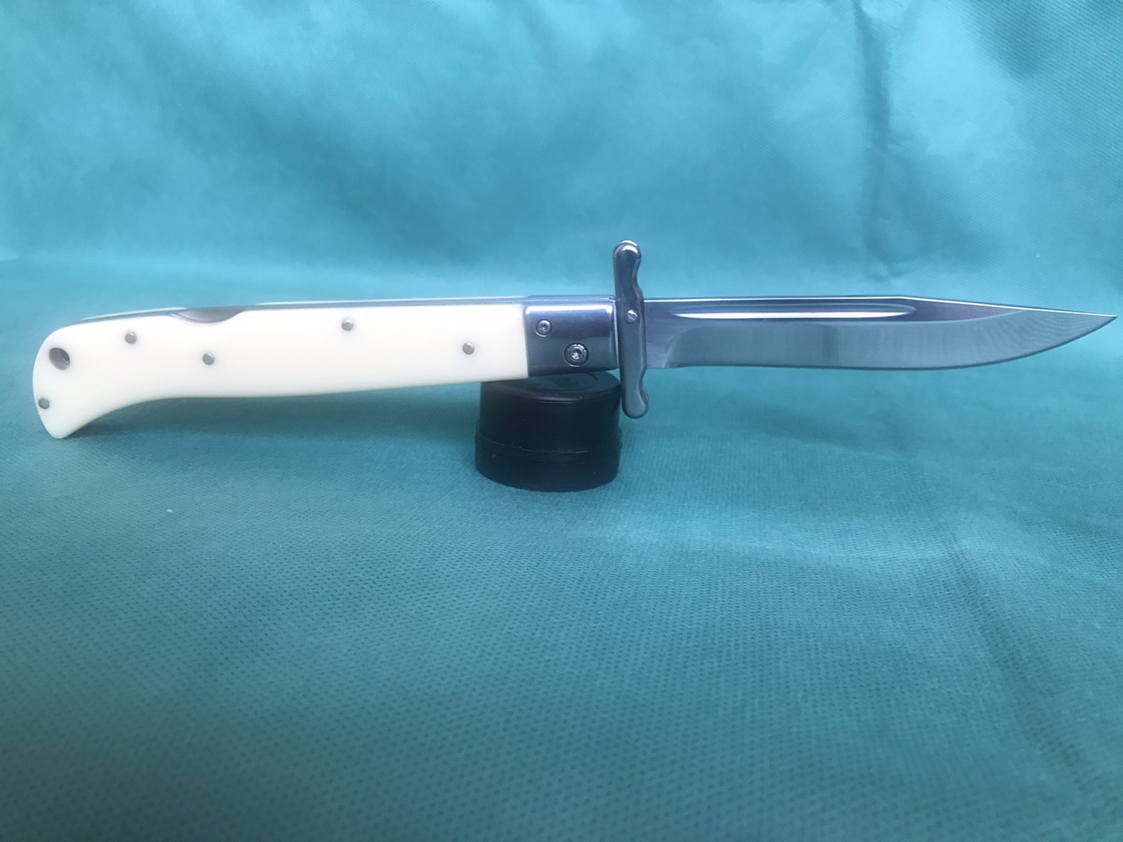 A unique, handcrafted folding pocket knife with a 440C steel blade. A unique, handcrafted folding pocket knife with a 440C steel blade.