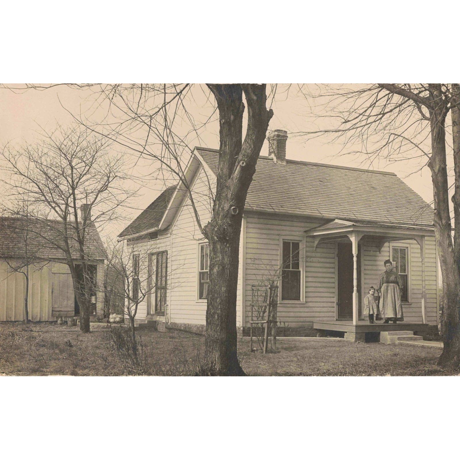 Antique AZO Real Photo Postcard RPPC Farmhouse Woman and Child on Porch Sepia