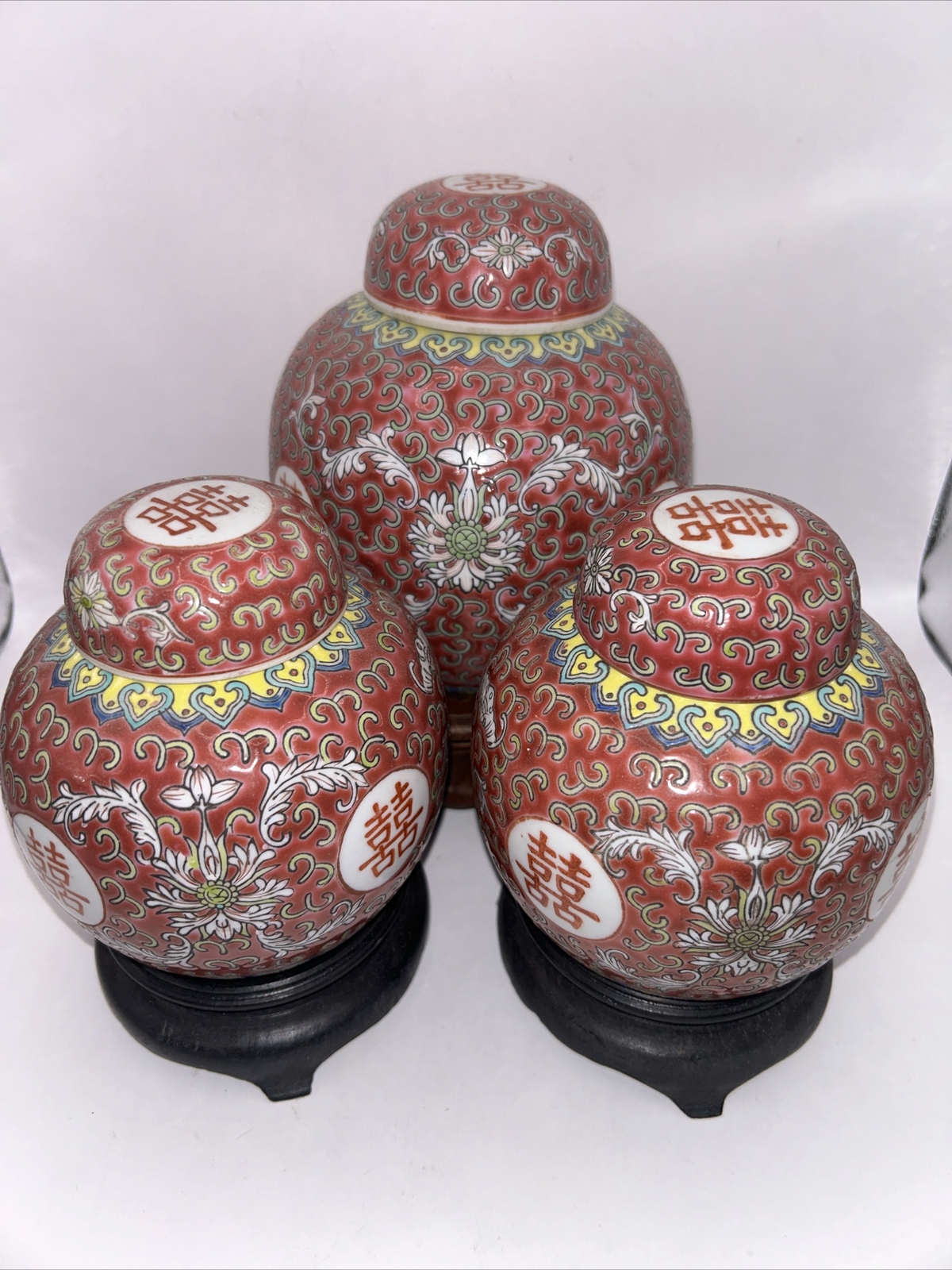 Set of 3 Red Famille Rose Porcelain Ginger Jars 6” and 5” Tall With Wood Base Set of 3 Red Famille Rose Porcelain Ginger Jars 6” and 5” Tall With Wood Base
