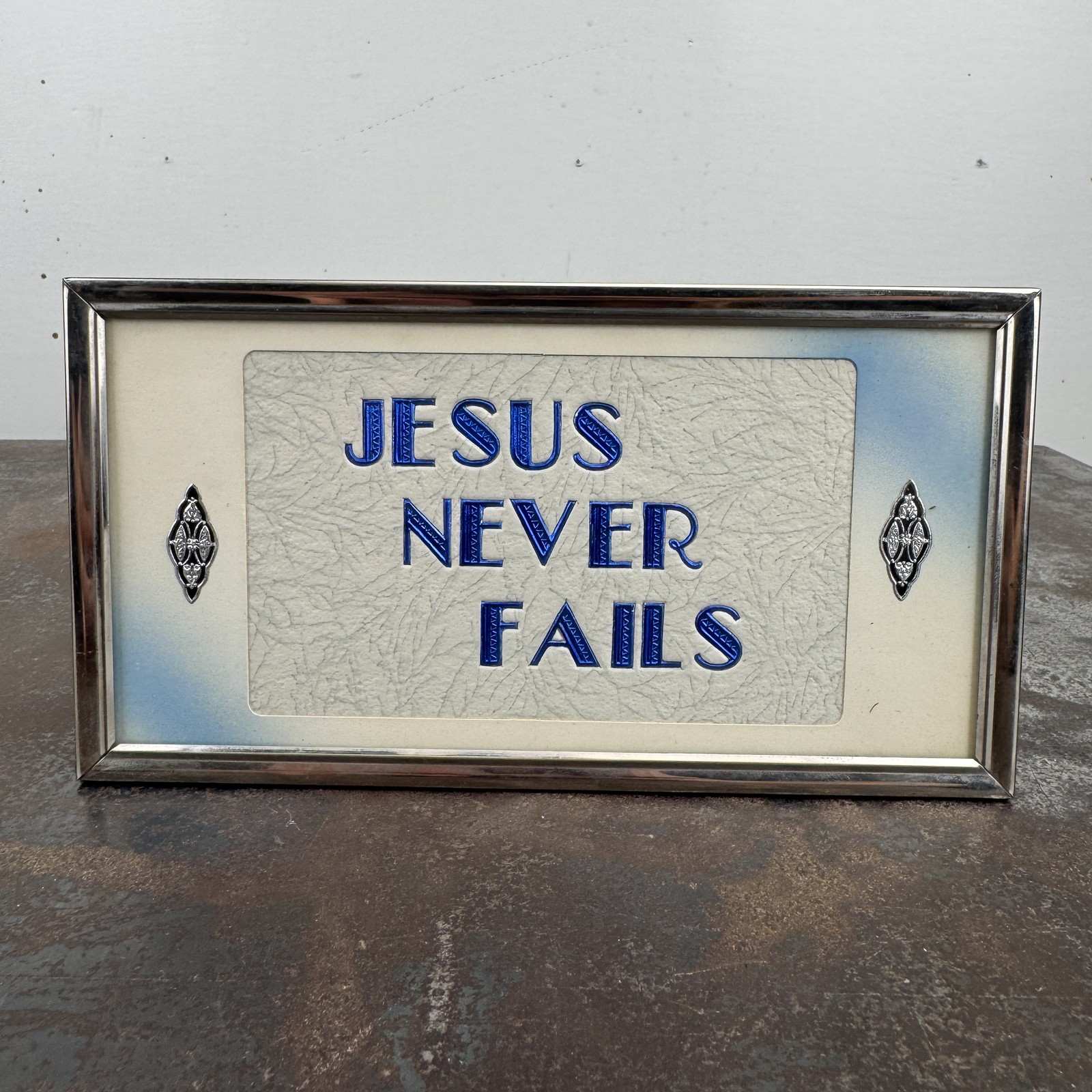 Vtg JESUS NEVER FAILS Framed Blue Metallic Sign / Wall Plaque - 7.5