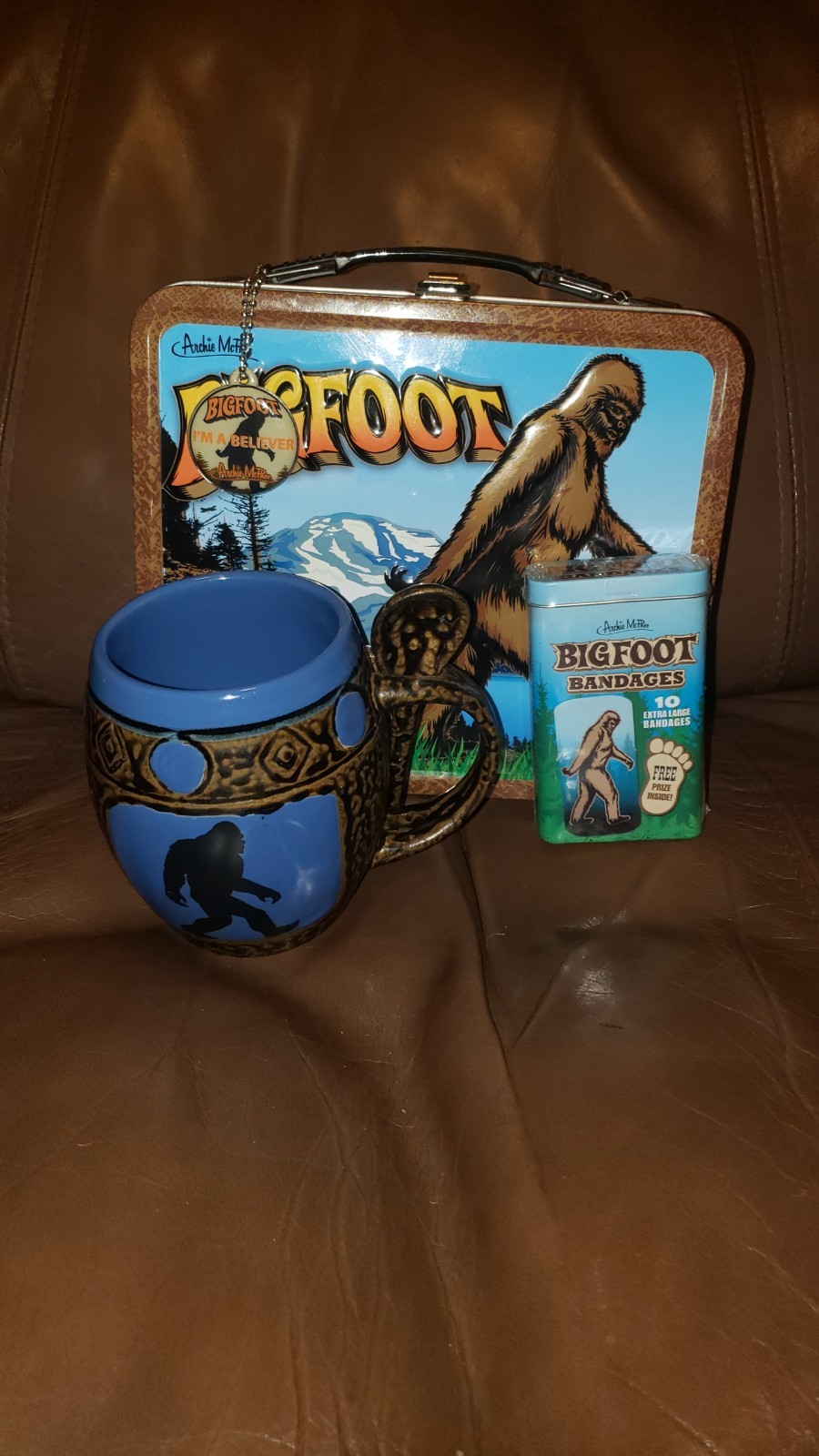 Bigfoot Lunchbox Lot with Mug, Spoon, Bandages, and Enamel Pin Bigfoot Lunchbox Lot with Mug, Spoon, Bandages, and Enamel Pin