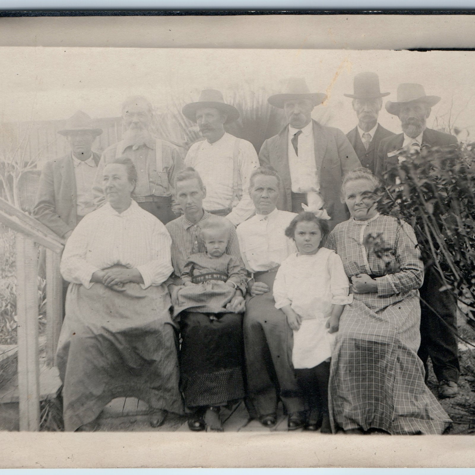c1910s Outdoor Family Group RPPC Cowboy Hats Dog Garden Porch Photo Postcard