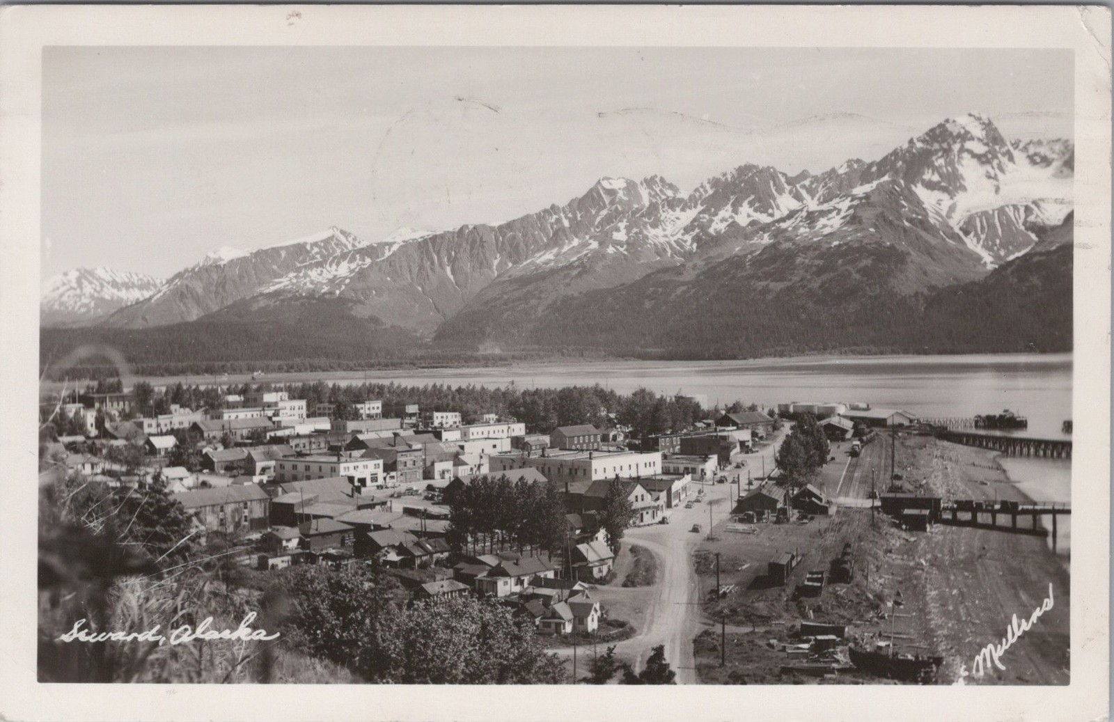 1954 Panoramic view of Seward waterfront town AK RPPC Snowy Mountains Postcard