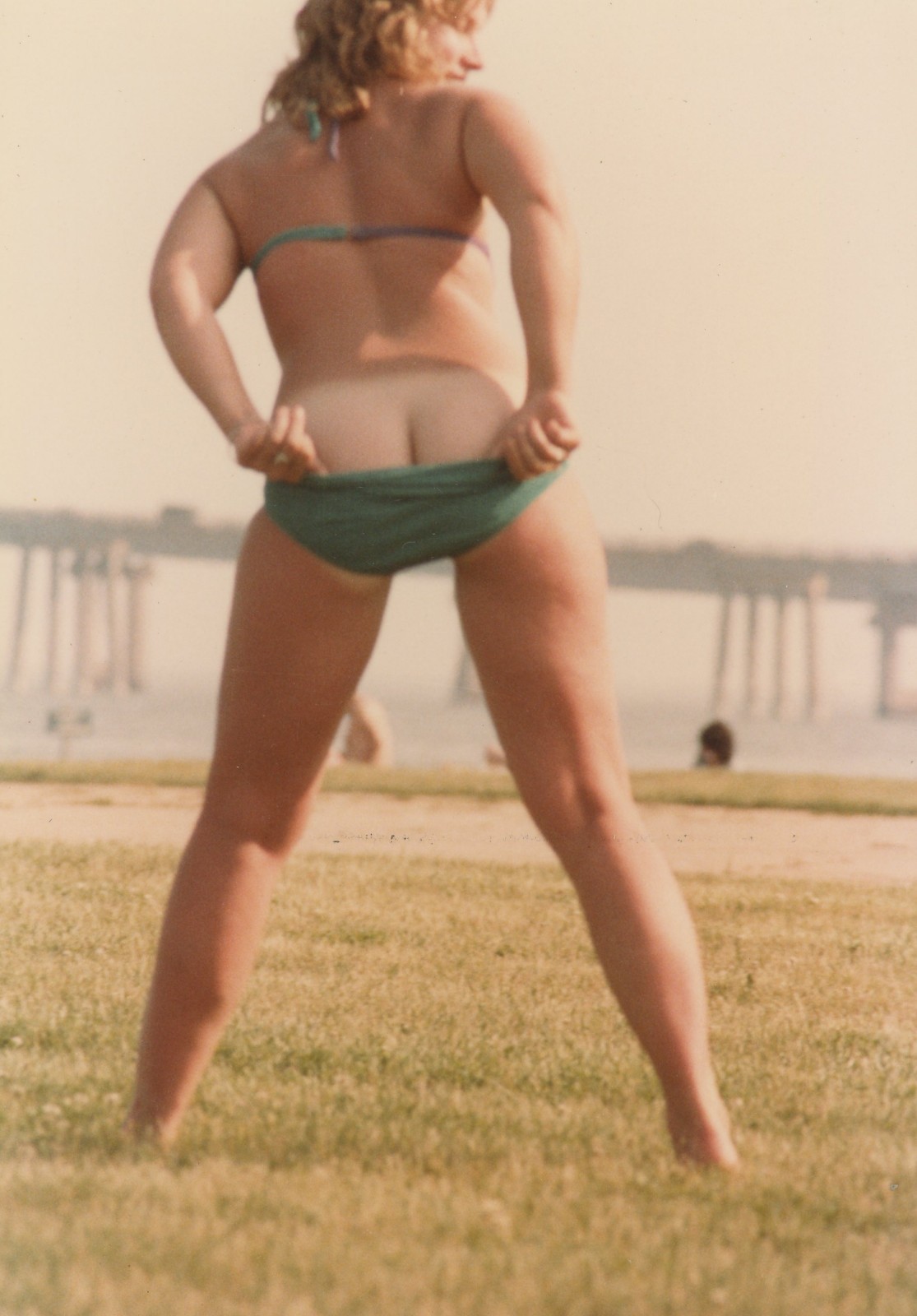 Woman Pulling Down Bikini Bottoms Swimsuit Tan Lines Beach VTG Photo 1980s Woman Pulling Down Bikini Bottoms Swimsuit Tan Lines Beach VTG Photo 1980s