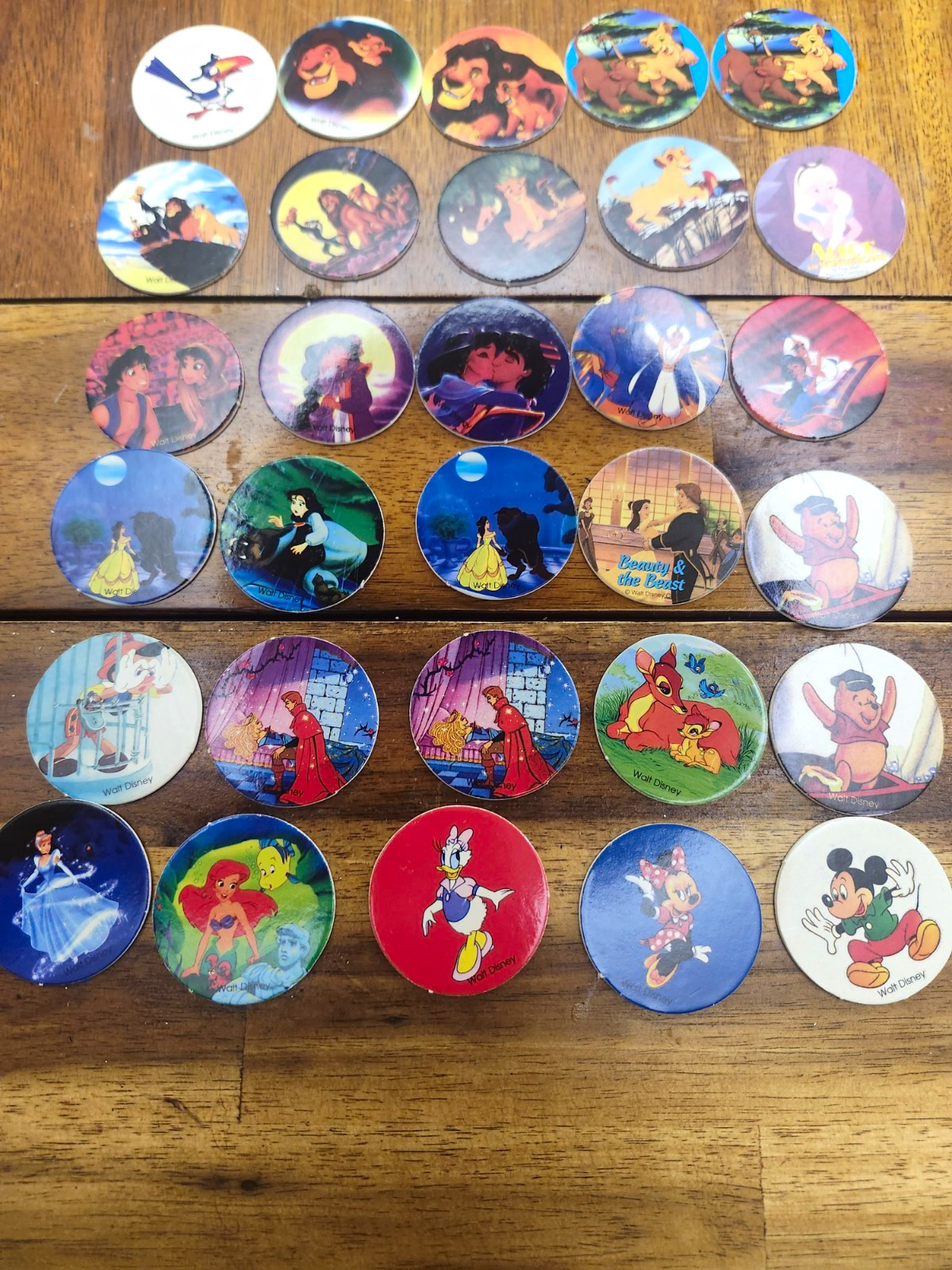 30 Vintage Walt Disney Pog slammer Lion King, Beauty and the beast, and Alladin. 30 Vintage Walt Disney Pog slammer Lion King, Beauty and the beast, and Alladin.