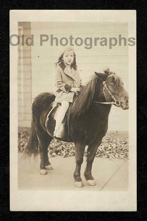 RPPC KID GIRL HORSEBACK PONY RIDE SIDEWALK OLD/VINTAGE PHOTO- A2