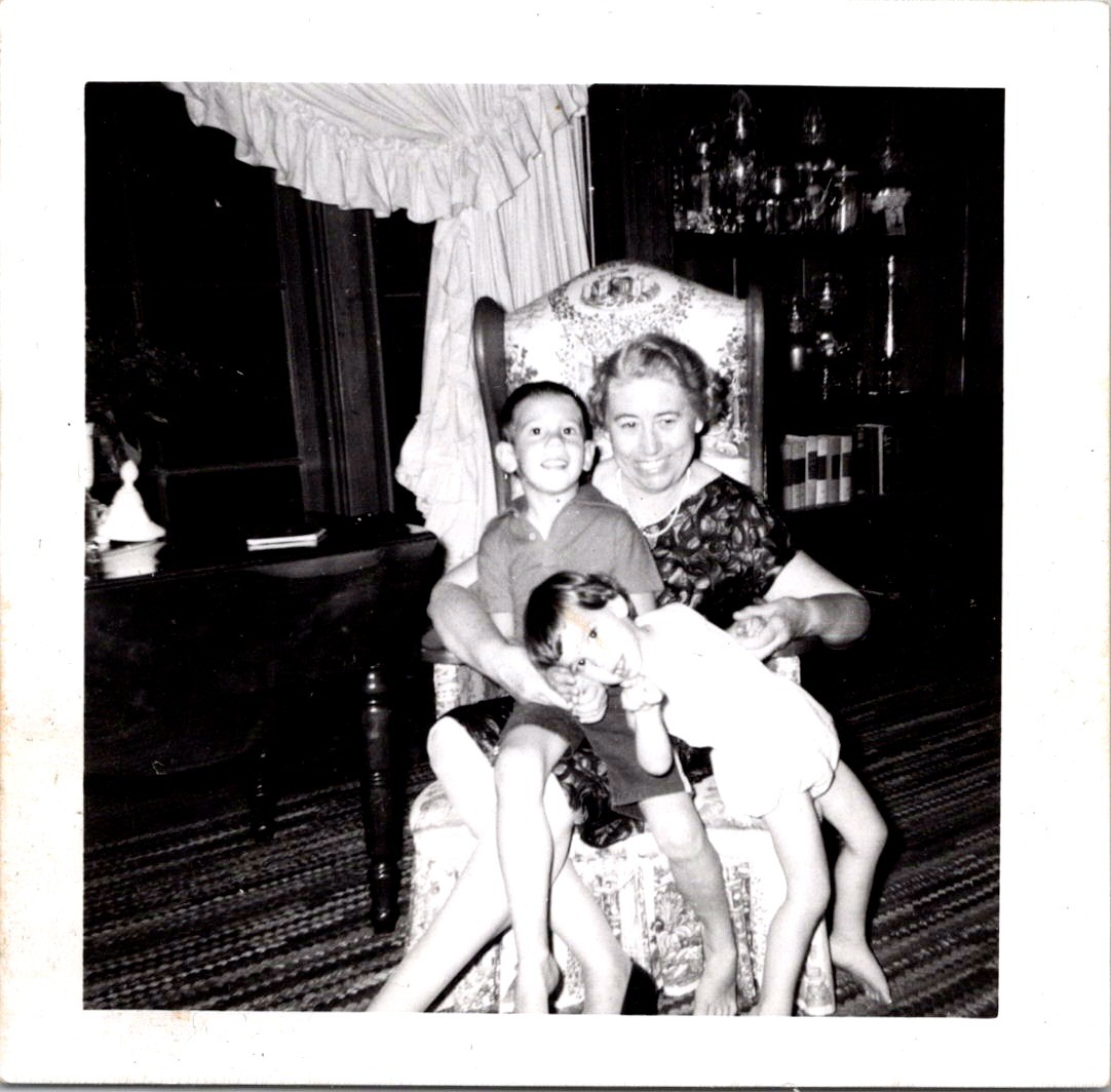 Grandmother with Grandchildren in Living Room, 1950s B&W Snapshot Photo Grandmother with Grandchildren in Living Room, 1950s B&W Snapshot Photo