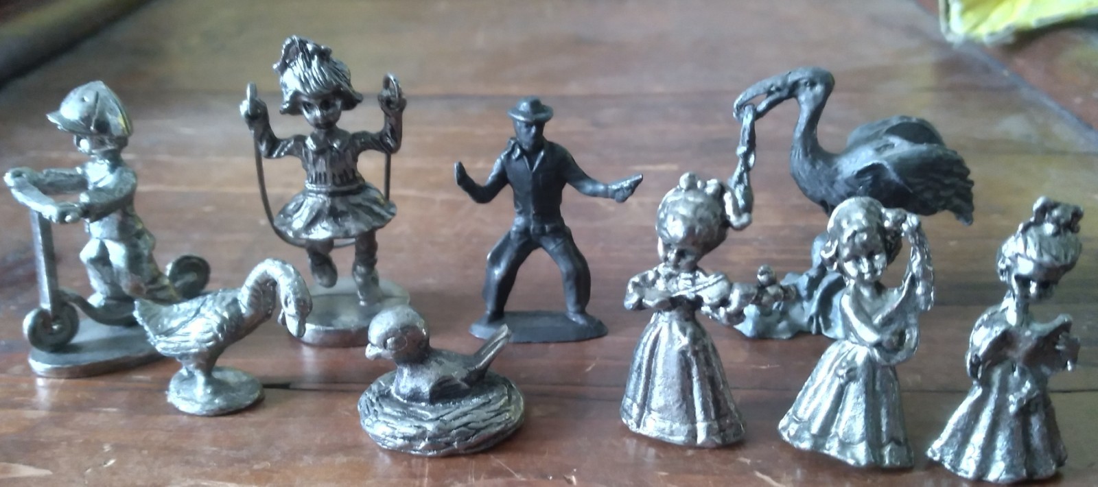 Lot of 9 Pewter/style Figurines.  Stork&baby-bird&nest-children-cowboy-swan