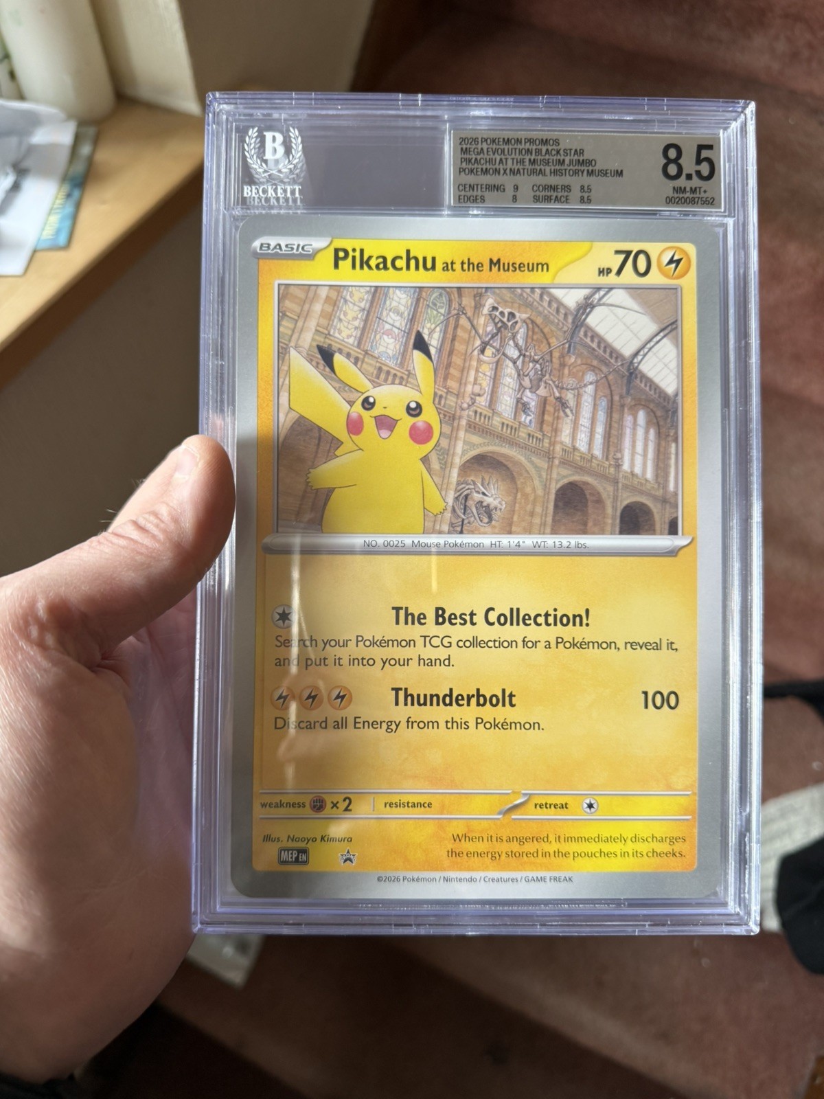 2026 POKEMON MEP EN-ME BLACK STAR PROMO PIKACHU AT THE MUSEUM Beckett 8.5