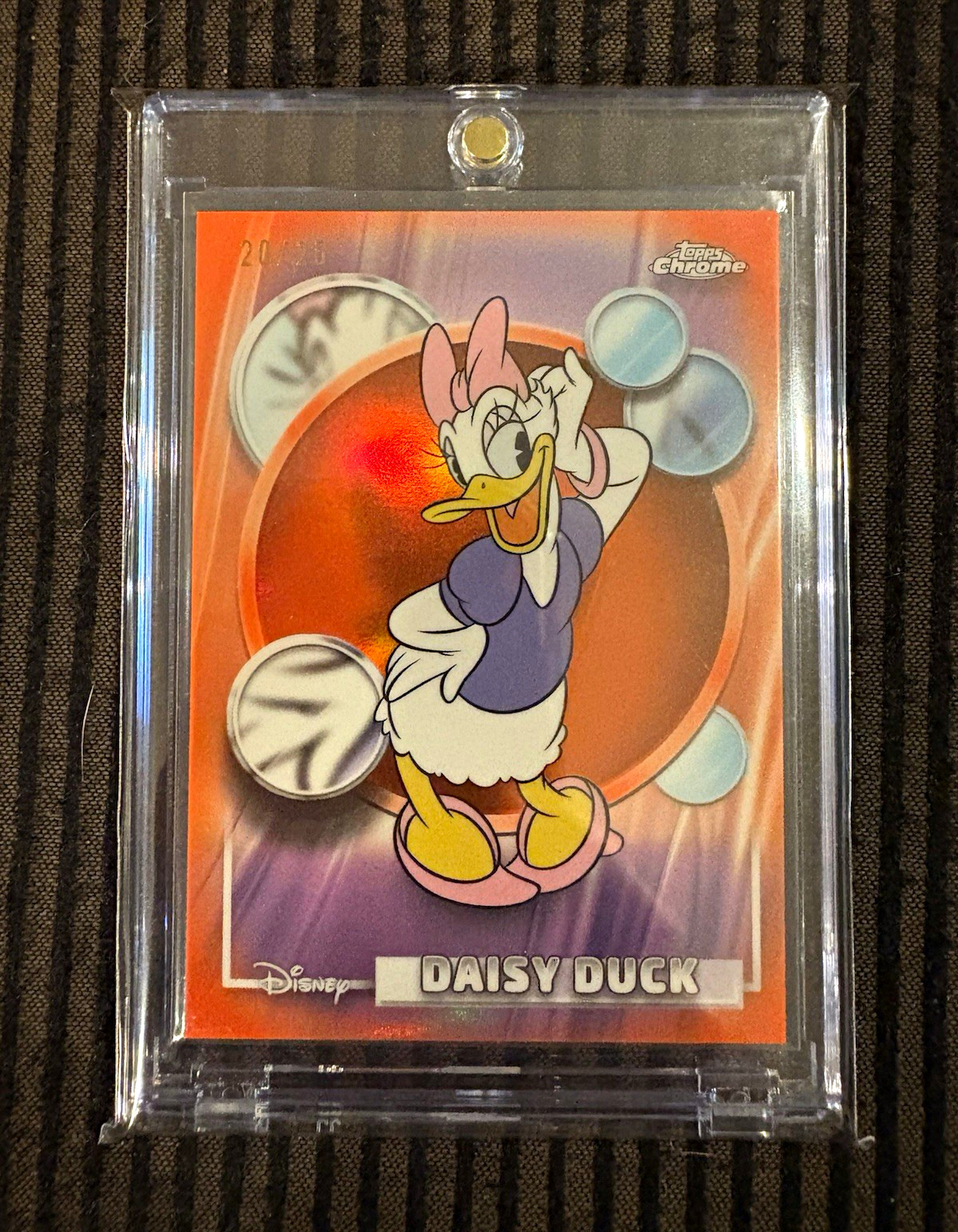 2026 Topps Chrome Disney Daisy Duck Orange Refractor /25 #54