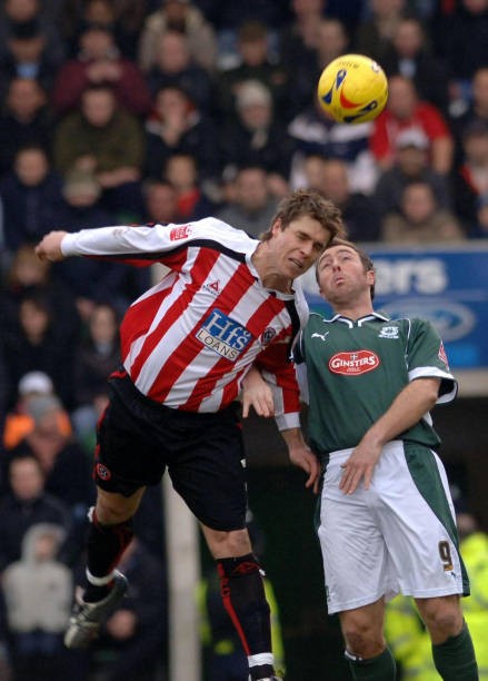 Sheffield United\'s Chris Armstong battles for the ball with Plymou- Old Photo