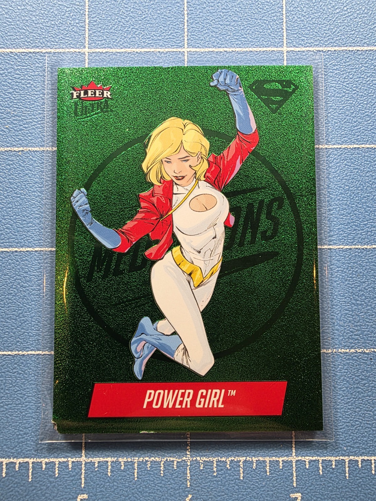 2026 Fleer Ultra Superman - Power Girl M-6 - Emerald 01/10 - Medallions - DMG 2026 Fleer Ultra Superman - Power Girl M-6 - Emerald 01/10 - Medallions - DMG
