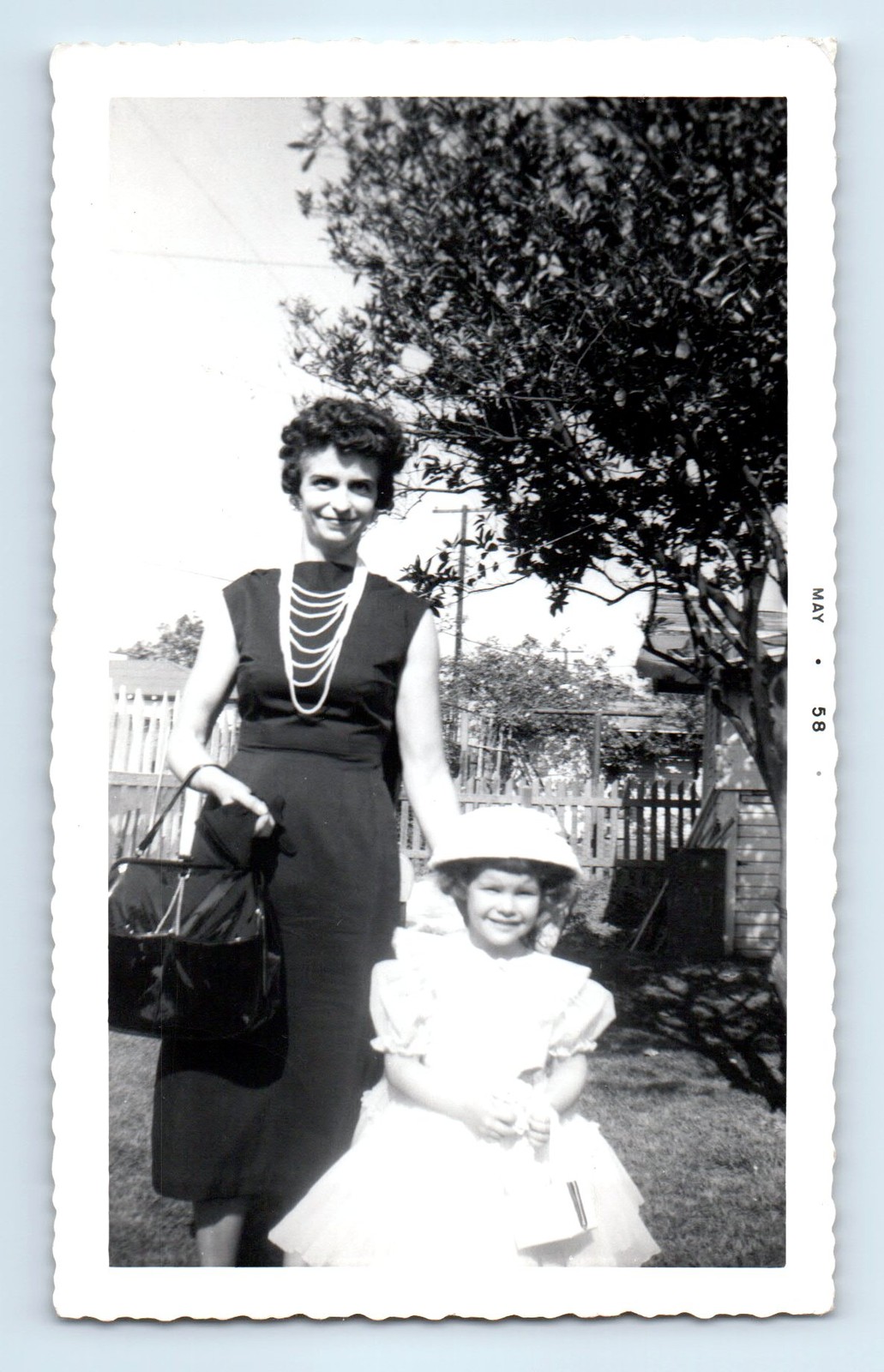 Old Vintage Photo WOMAN HOLDING PURSE GIRL DRESS HAT IN YARD 1958 SNAPSHOT