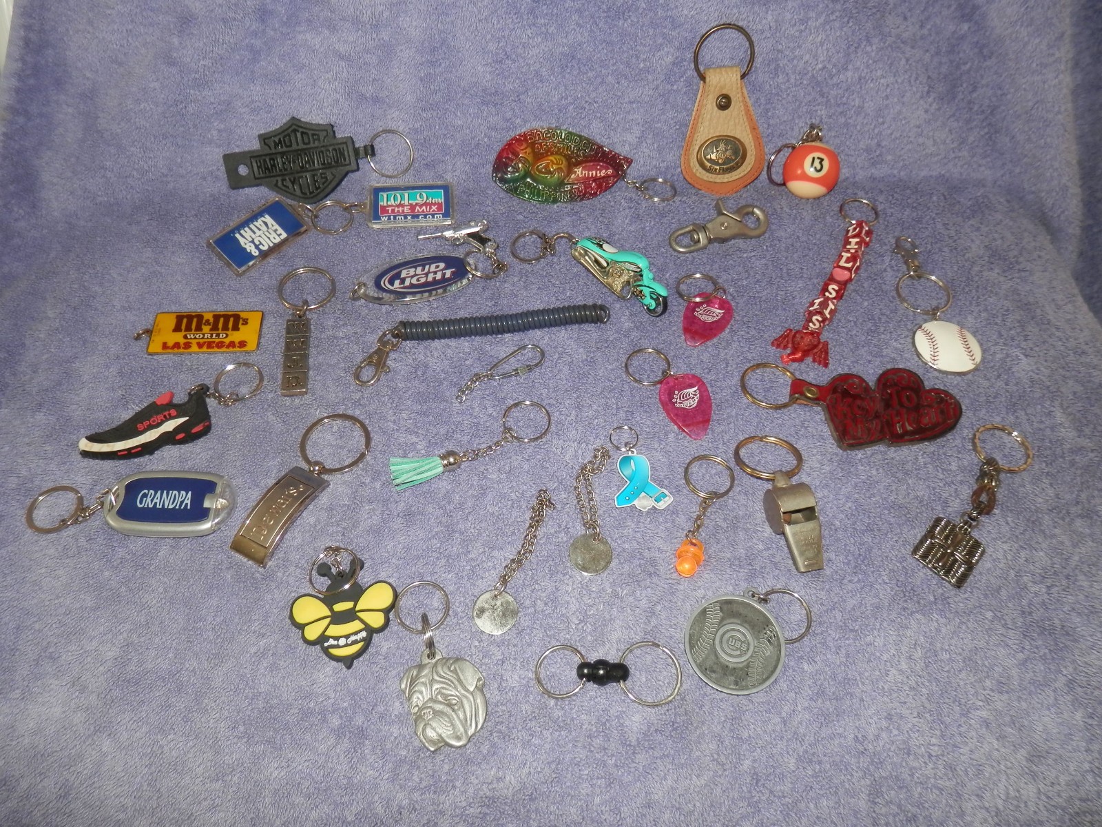 Large lot of key chains , cubs, m&m's six flags Bud light Harley Davidson & more