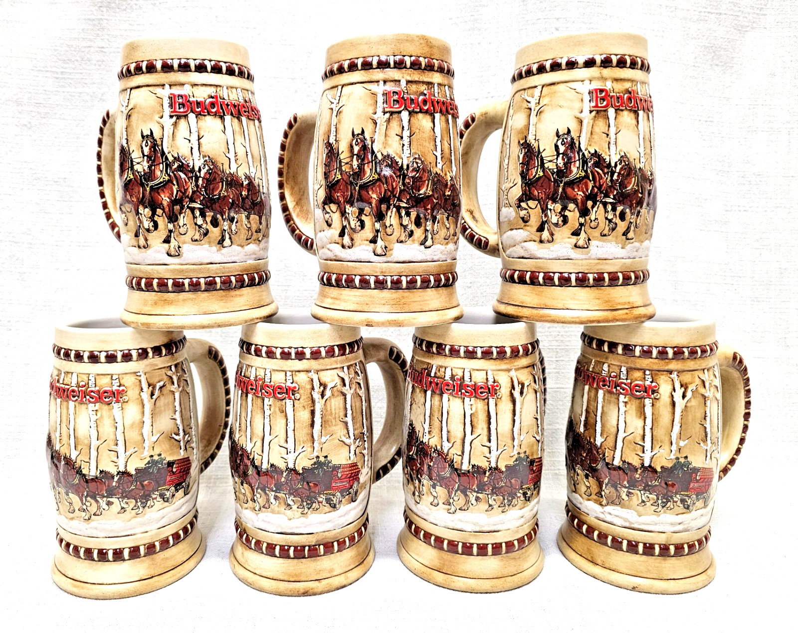 (7) 1981 Budweiser Ceramarte Clydesdale Holiday Steins BIN00 DS36