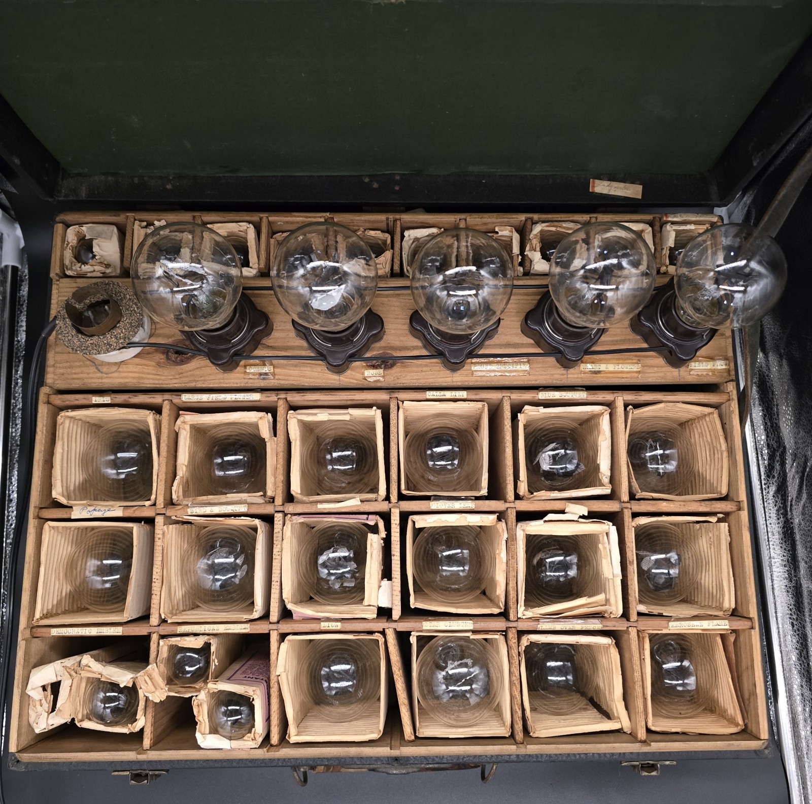 AeroLux Salesman kit with 34 bulbs, marketing material. and receipts.