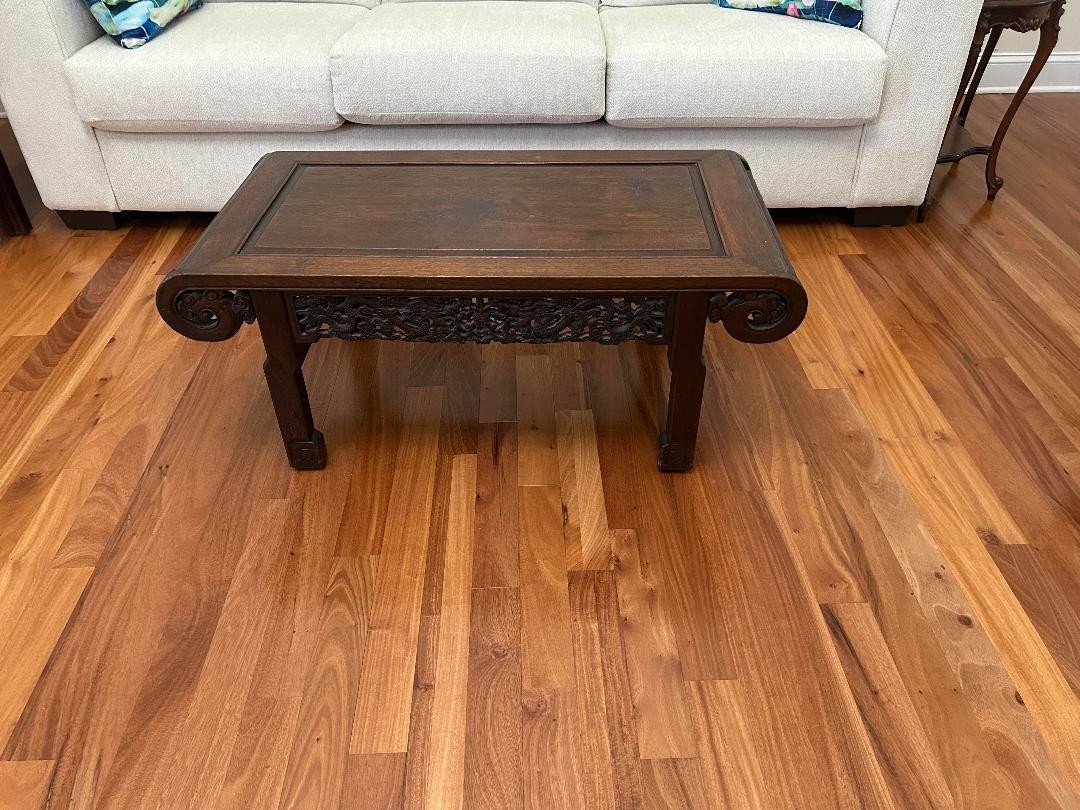 Wood hand-carved Chinese coffee table with dragon designs on aprons & ends. Wood hand-carved Chinese coffee table with dragon designs on aprons & ends.