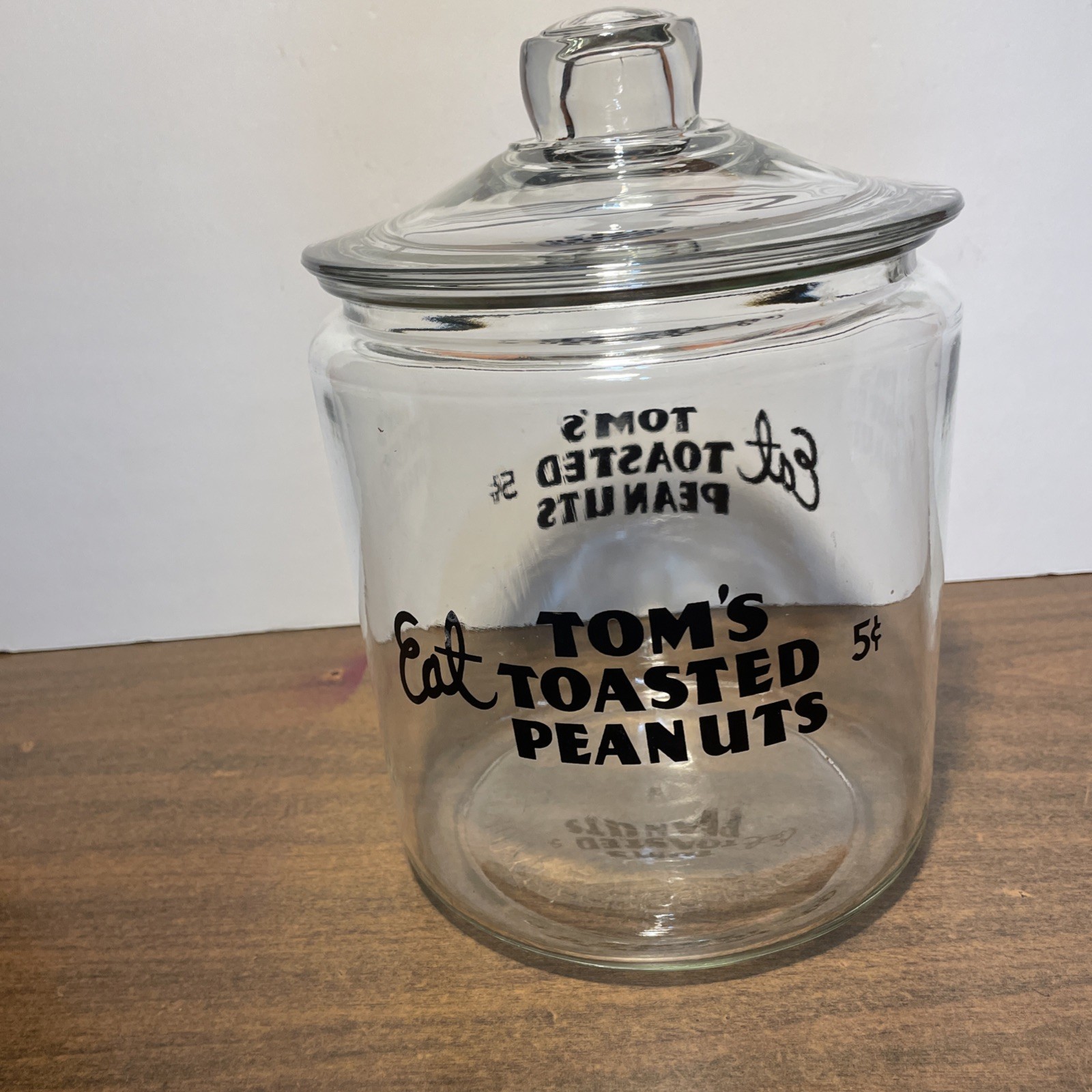 Vintage Tom’s Eat Toms Toasted Peanuts Clear Glass Jar - Clear Handled Lid Vintage Tom’s Eat Toms Toasted Peanuts Clear Glass Jar - Clear Handled Lid