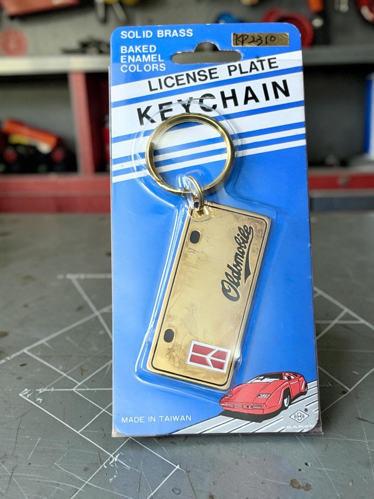 Vintage 1983 80s OLDSMOBILE Keychain License Plate NOS Solid Brass Baron GM