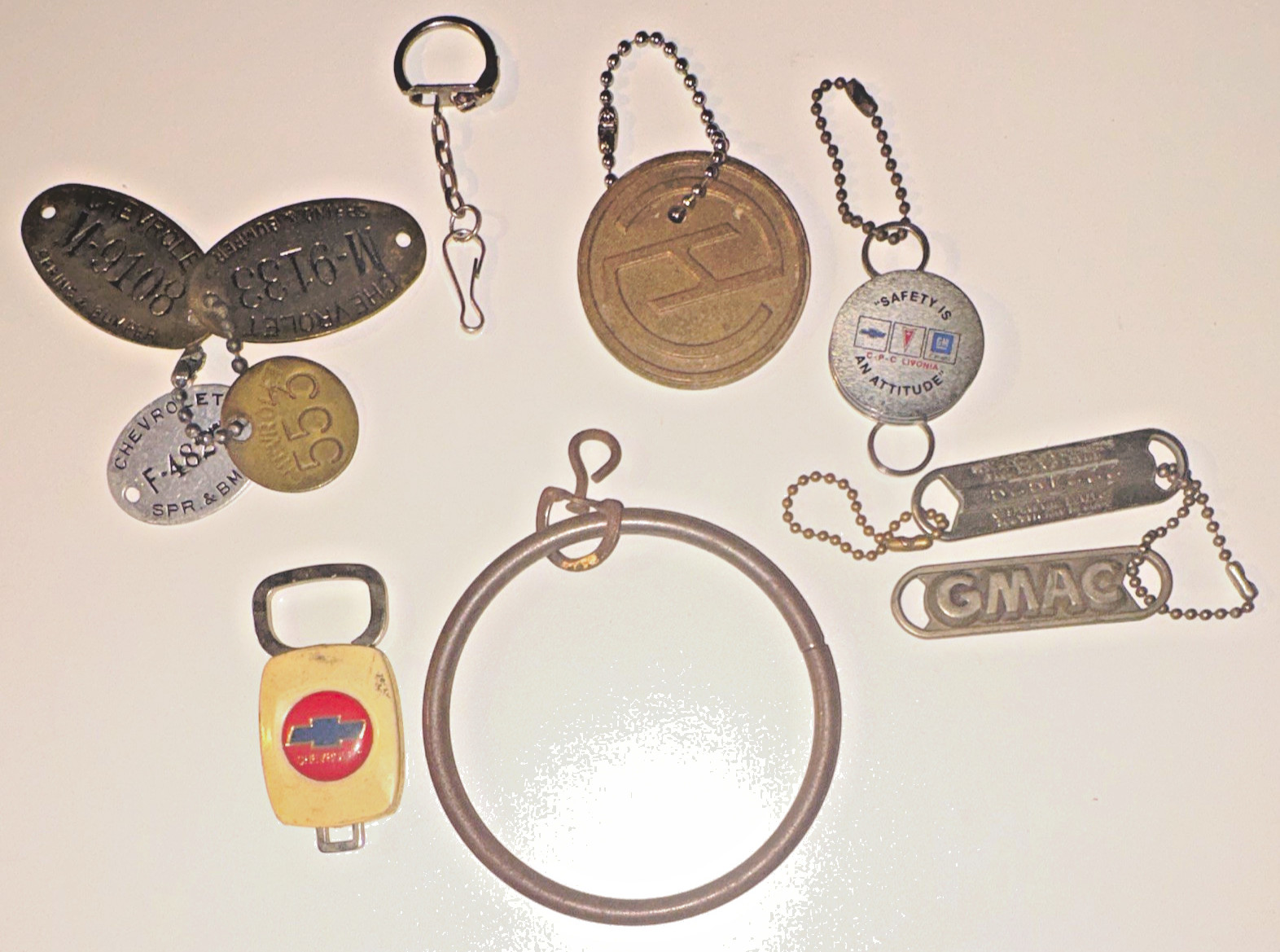 VTG Lot of 10 GM Chevrolet Bowtie Fob Brass Tool Tags GMAC Livonia Safety Lot