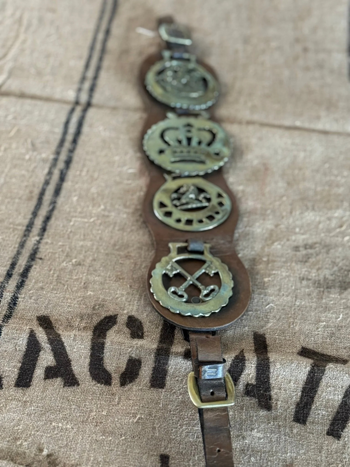 Set of Four Vintage Horse Brasses Mounted on Leather Strap Set of Four Vintage Horse Brasses Mounted on Leather Strap