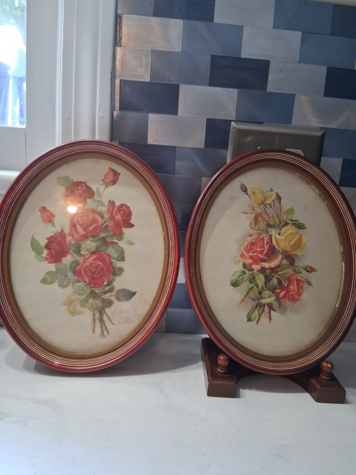 Two Vintage oval framed w/glass roses pictures