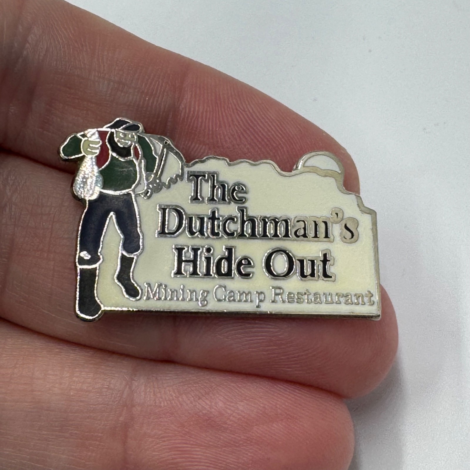 The Dutchman’s Hide Out Lapel Pin Mining Camp Restaurant Souvenir The Dutchman’s Hide Out Lapel Pin Mining Camp Restaurant Souvenir
