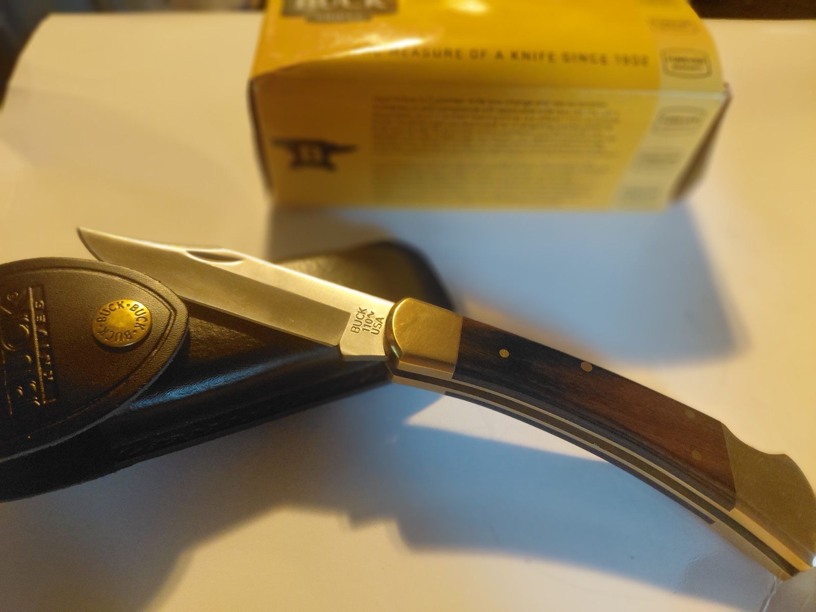 Buck 110 Folding Pocketknife Wood Handle Gold Lockback w/ Sheath & Box Buck 110 Folding Pocketknife Wood Handle Gold Lockback w/ Sheath & Box