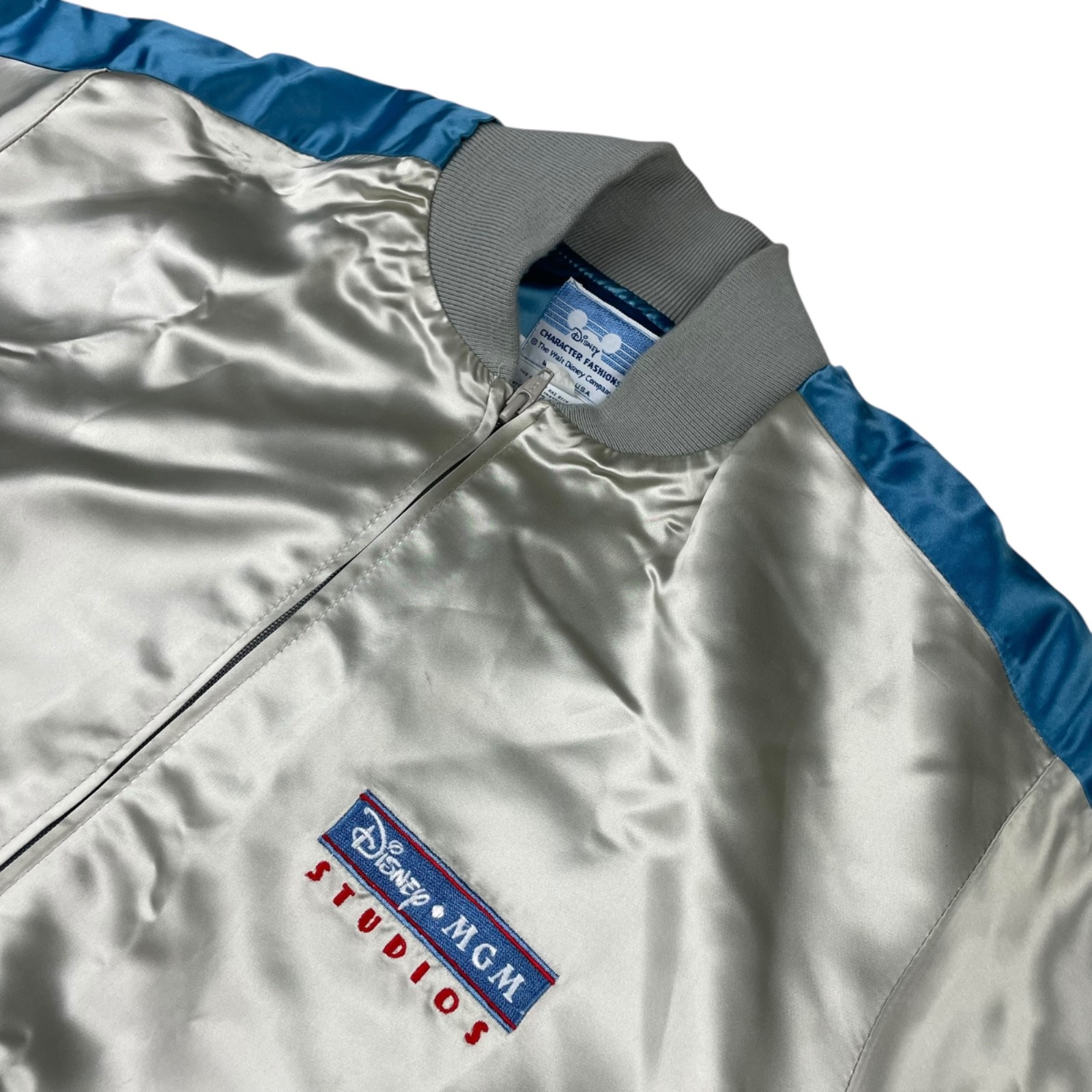 VTG Disney World MGM Studios Cast Member Satin Bomber Jacket Silver • USA • 2XL VTG Disney World MGM Studios Cast Member Satin Bomber Jacket Silver • USA • 2XL