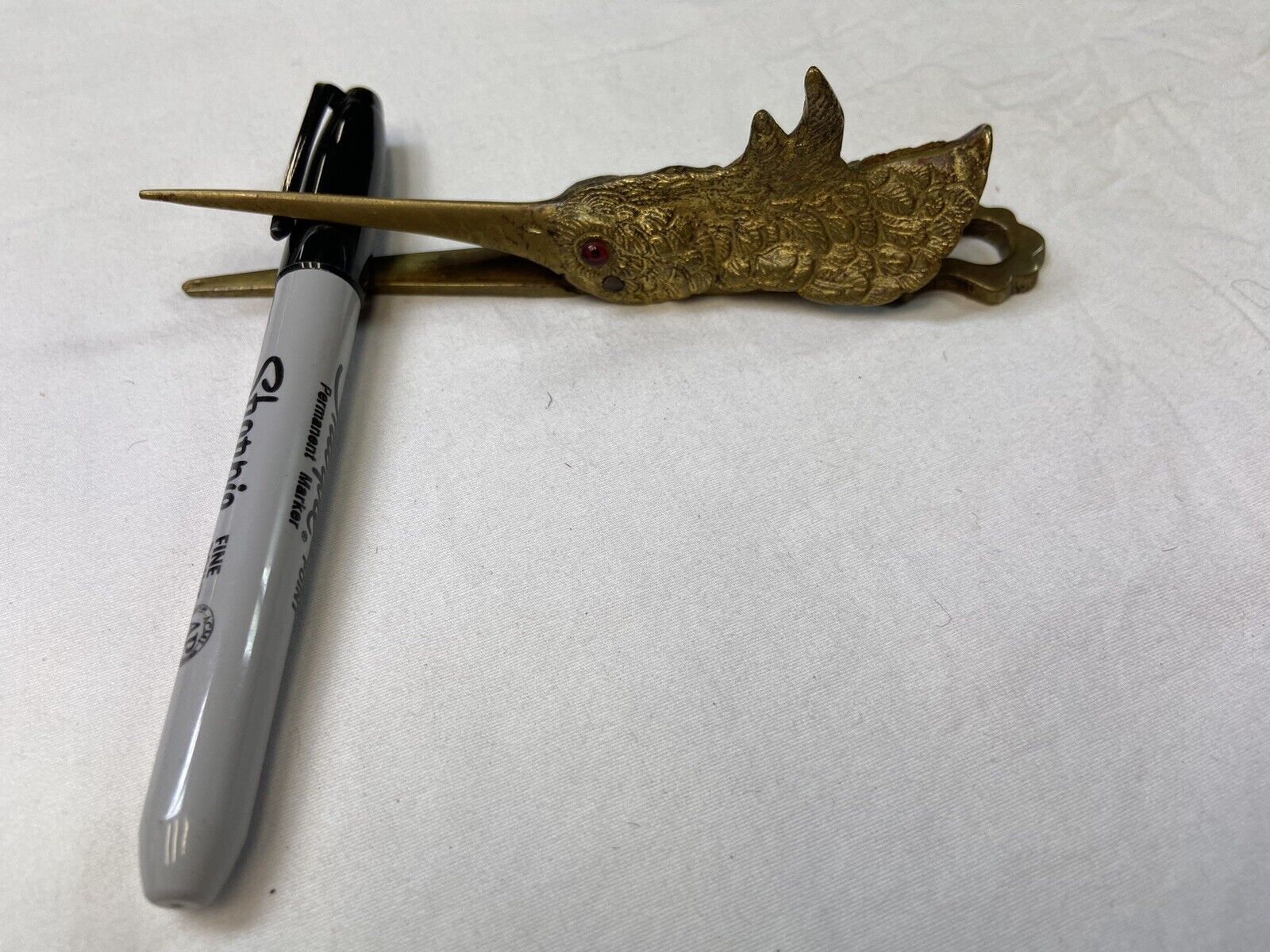 Victorian brass/glass eye Stork paper clip.       A Rare Find $225