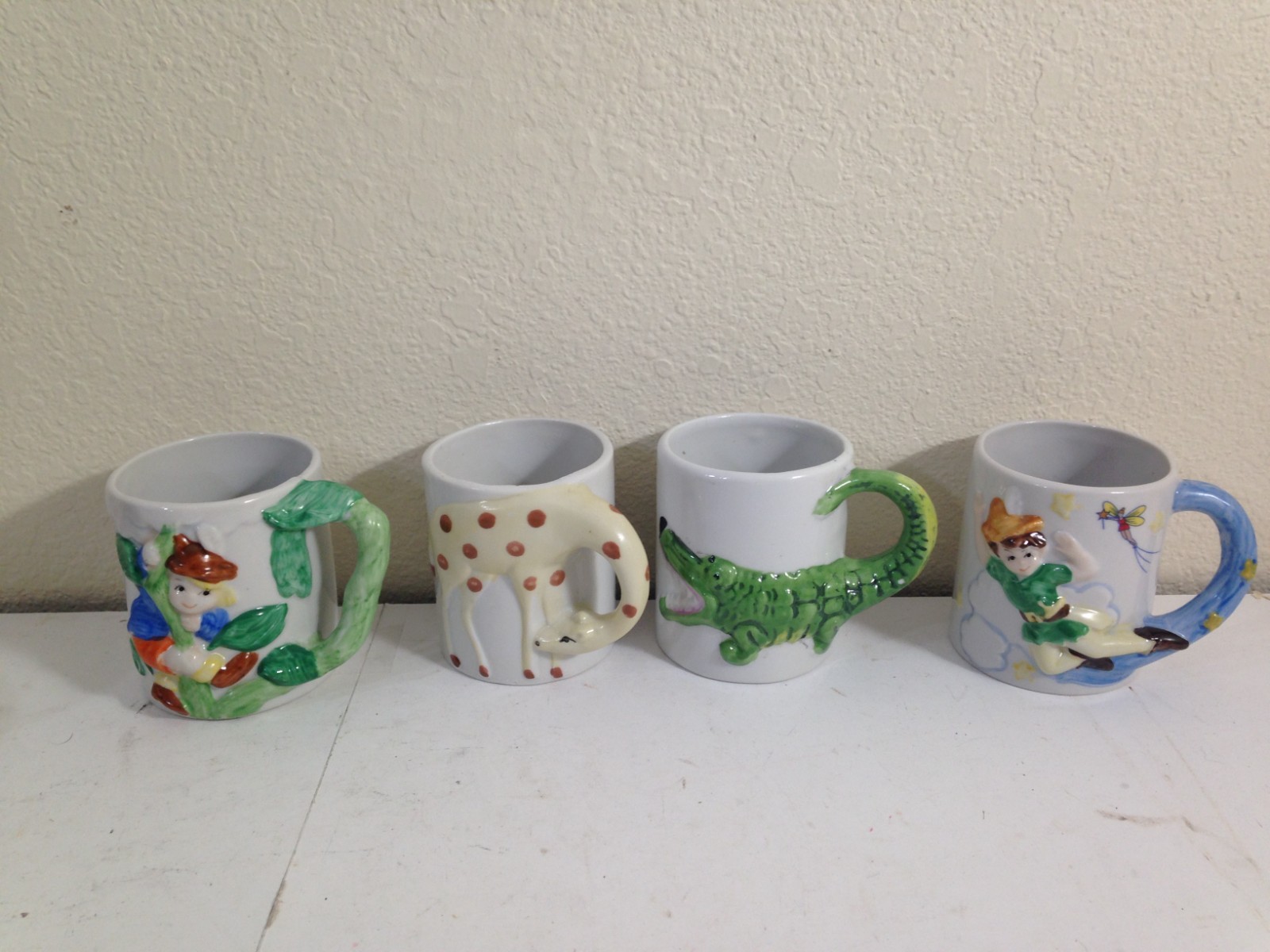 4 Vtg Jack and the Beanstalk, Peter Pan, Giraffe, Crocodile Child's Mug Cup JSNY 4 Vtg Jack and the Beanstalk, Peter Pan, Giraffe, Crocodile Child's Mug Cup JSNY