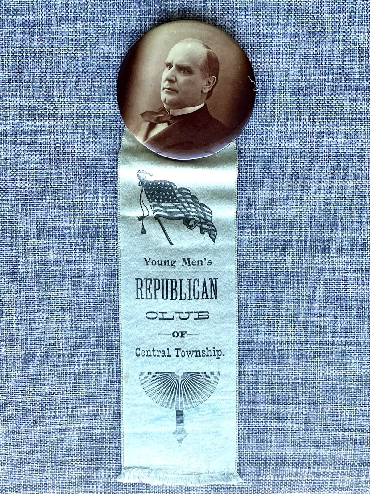 1896 William McKinley 2 1/8” Sepia Photo Cello Button W/Blue Ribbon 7 1/2”L 1896 William McKinley 2 1/8” Sepia Photo Cello Button W/Blue Ribbon 7 1/2”L