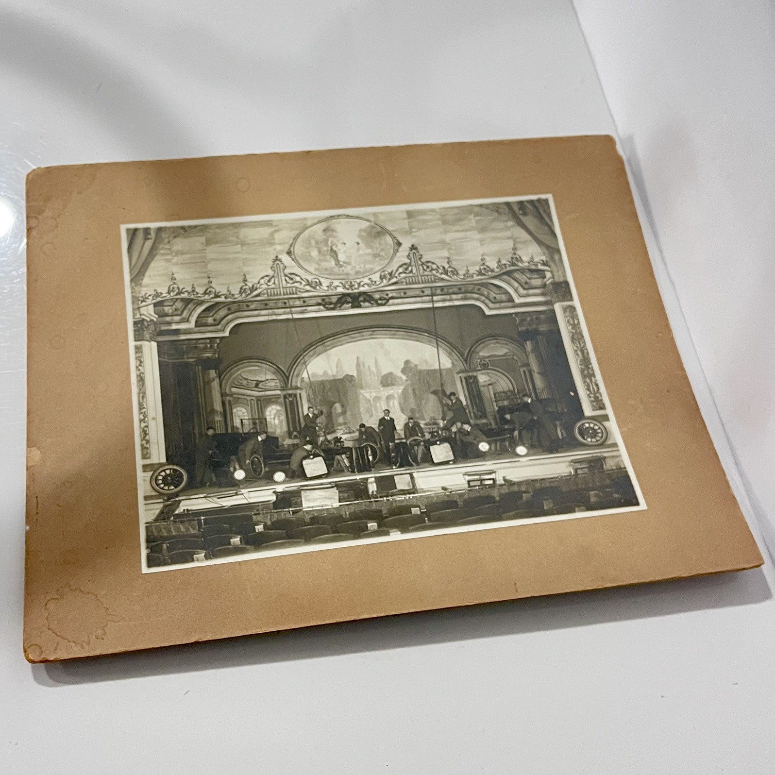 Vintage Black & White Photograph – Ornate Theater Stage with Early Automobiles