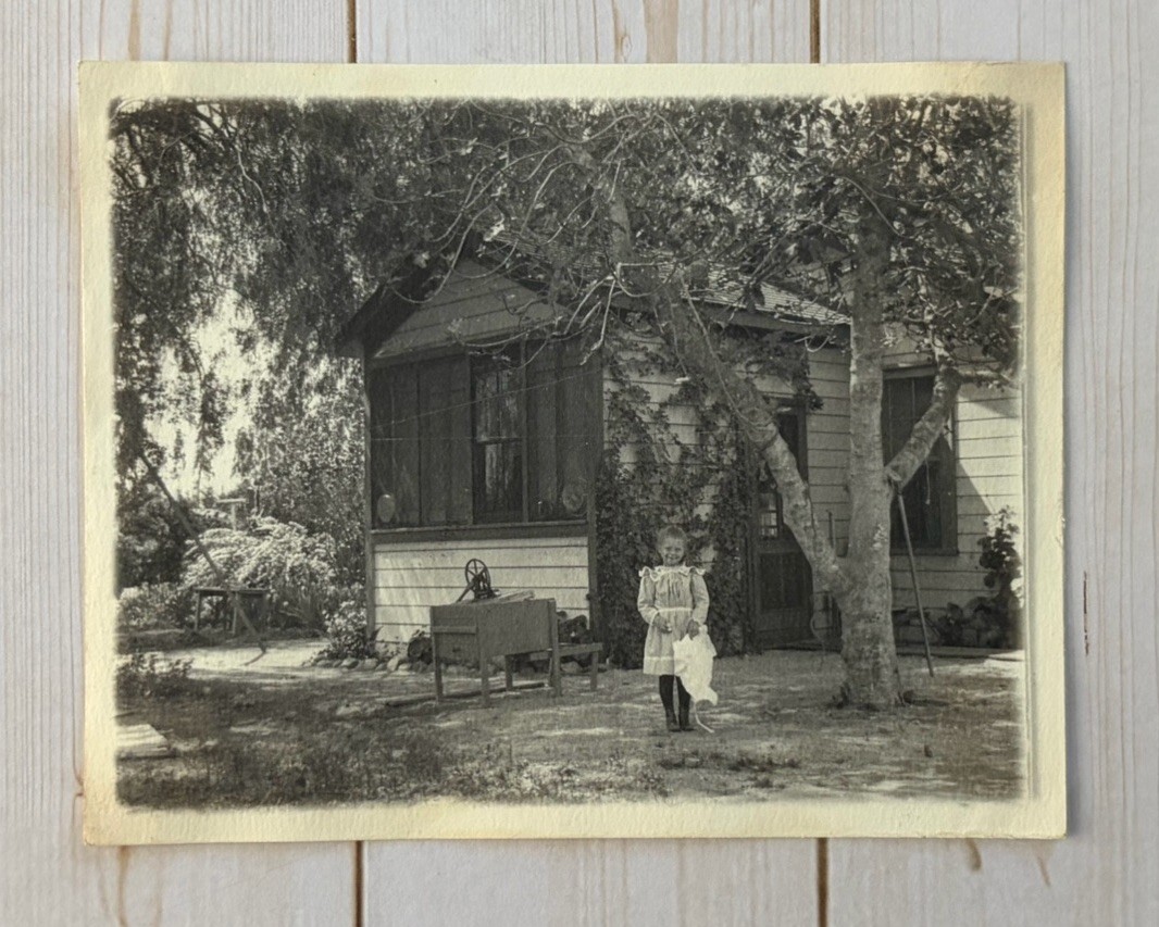 Antique Snapshot Photo Cute Young Girl Posing Under Tree Next To Home