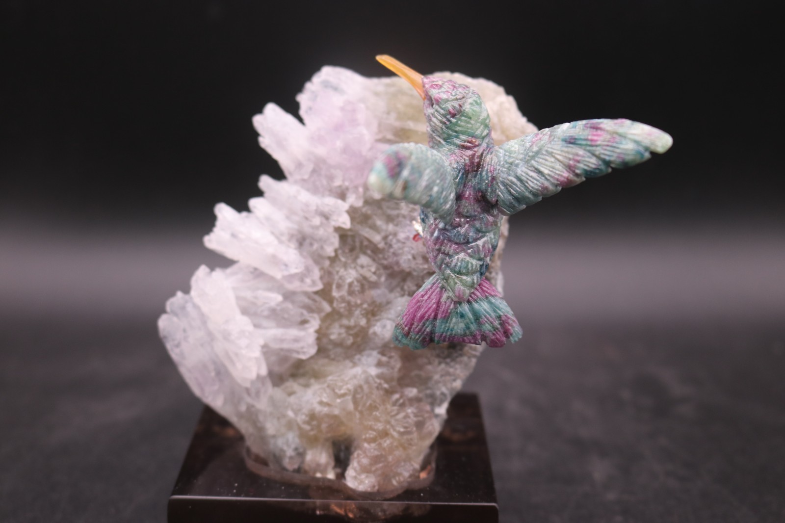Peter Muller Hand Carved Ruby Zoisite Hummingbird on Amethyst Flower Base Peter Muller Hand Carved Ruby Zoisite Hummingbird on Amethyst Flower Base