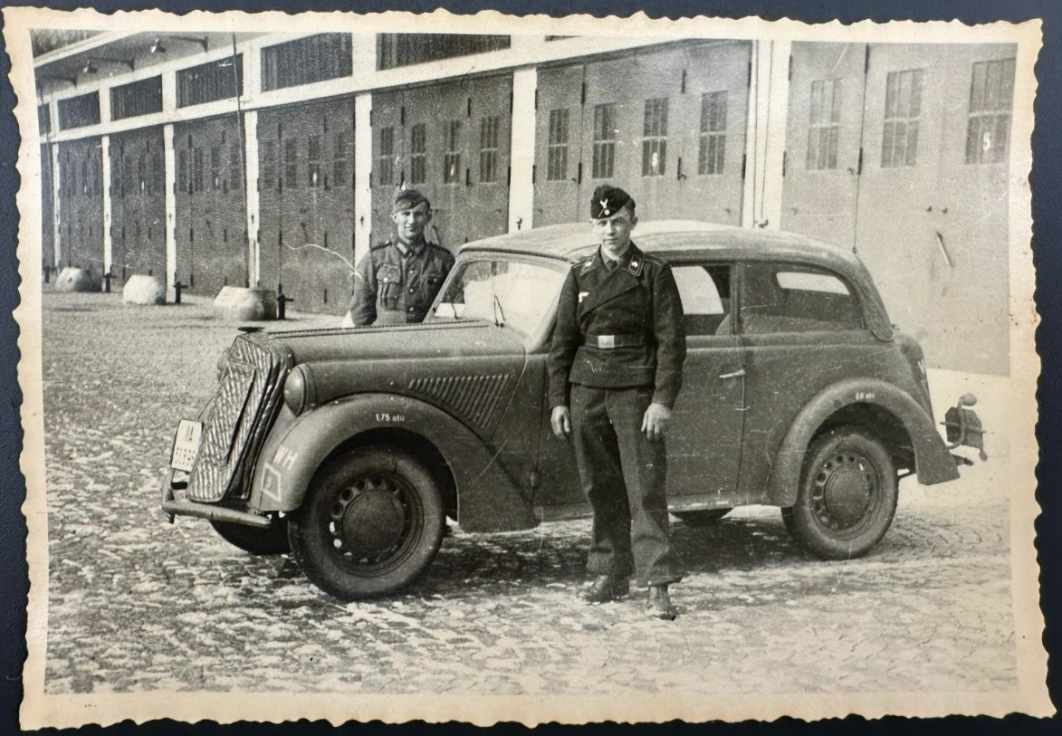 1940\'s WWII Two German soldiers next to an Opel Olympia Car