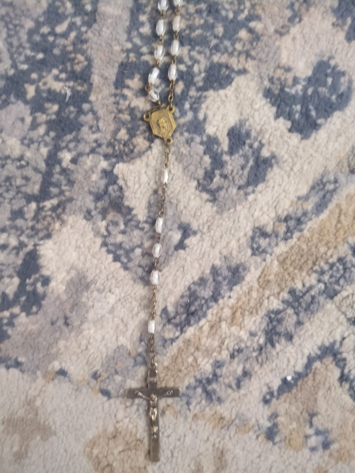 image shows a vintage or antique Catholic rosary featuring clear or givré glass