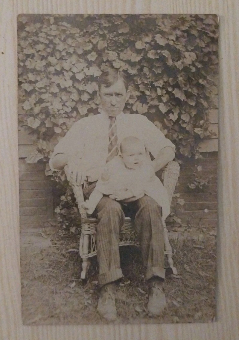 Vintage RPPC Postcard Man Holding Baby Wicker Chair Ivy Background Antique Photo Vintage RPPC Postcard Man Holding Baby Wicker Chair Ivy Background Antique Photo