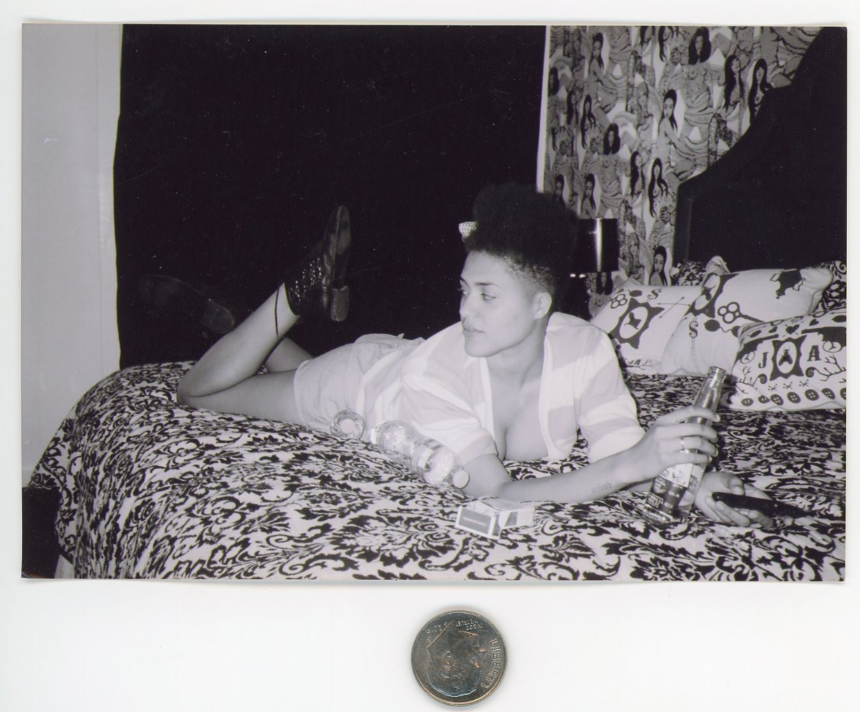 Old 1980's B&W photo / Young Black Woman on Bed with Beer Cigarettes & Remote Old 1980's B&W photo / Young Black Woman on Bed with Beer Cigarettes & Remote
