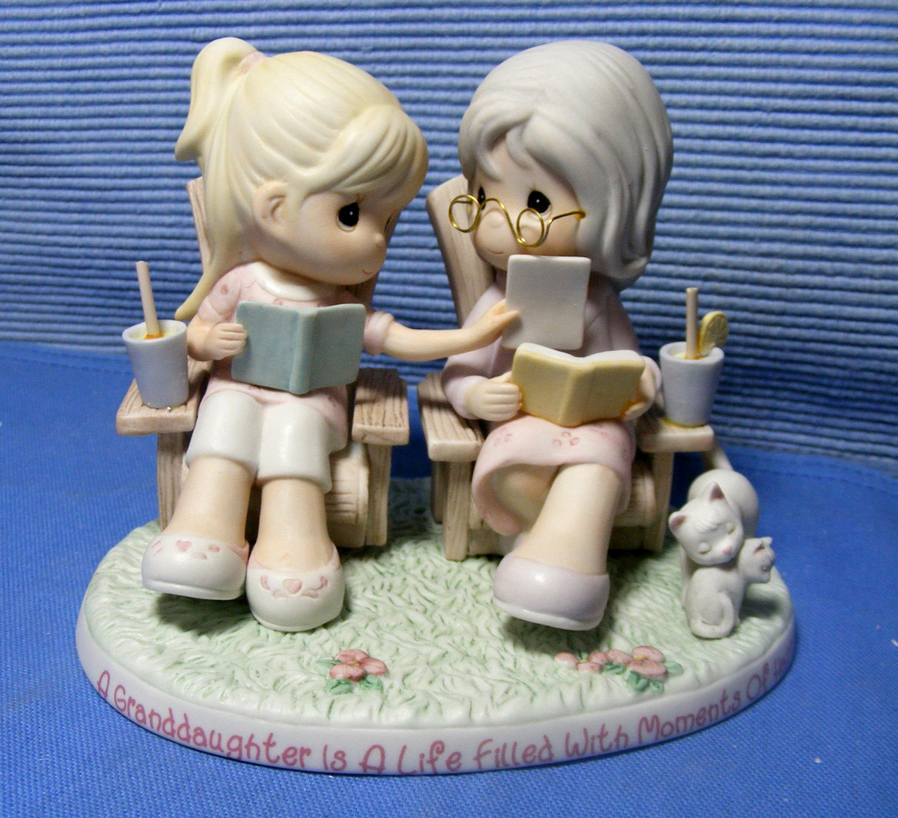 Precious Moments A GRANDDAUGHTER IS A LIFE FILLED WITH MOMENTS OF HAPPINESS A015
