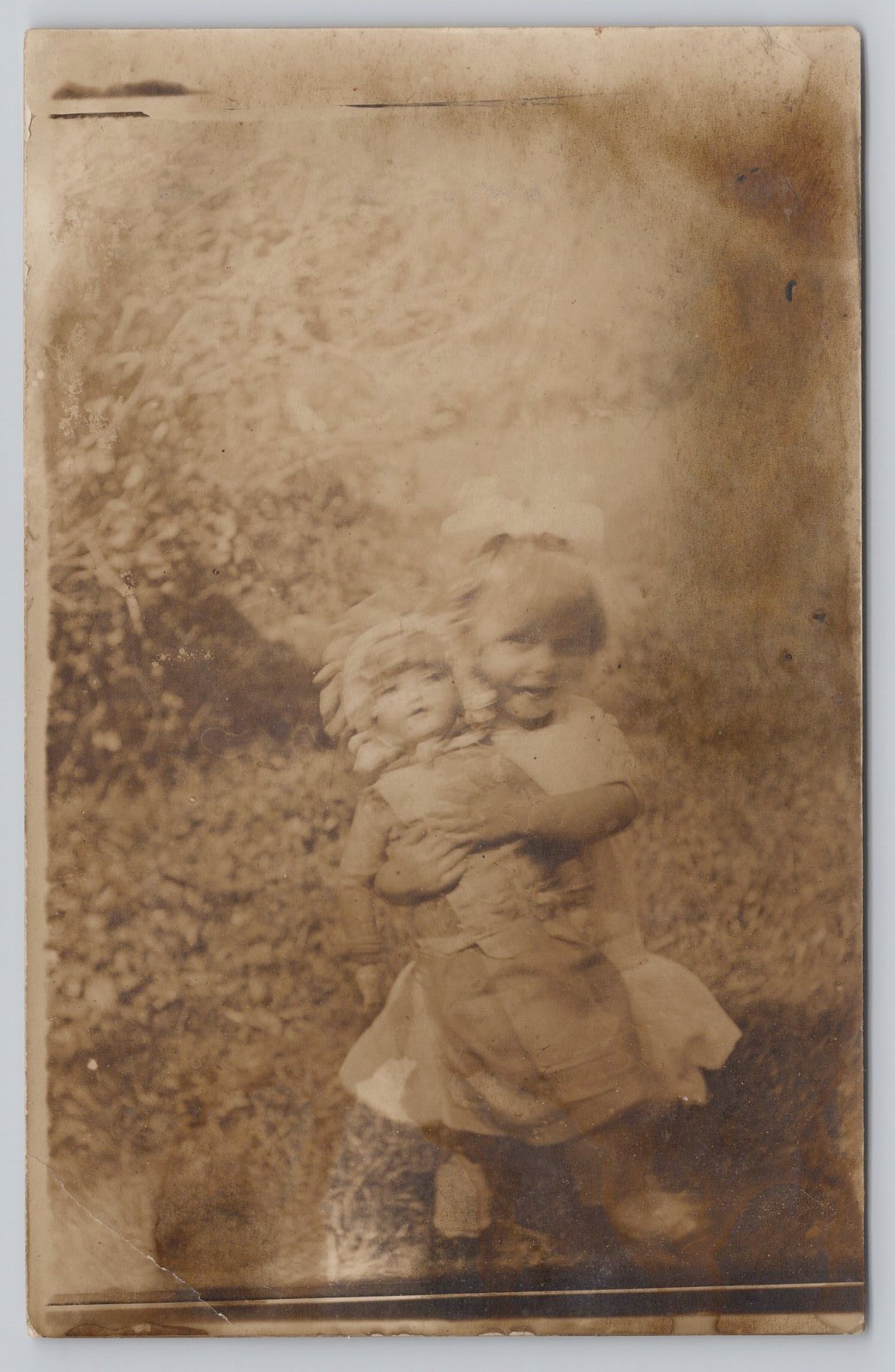 RPPC Happy Little Girl with Big Dollies Blurry Real Photo Vintage Postcard RPPC Happy Little Girl with Big Dollies Blurry Real Photo Vintage Postcard