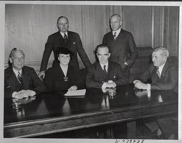 Frances Perkins Secretary of Labor is shown in conference with Gov- Old Photo