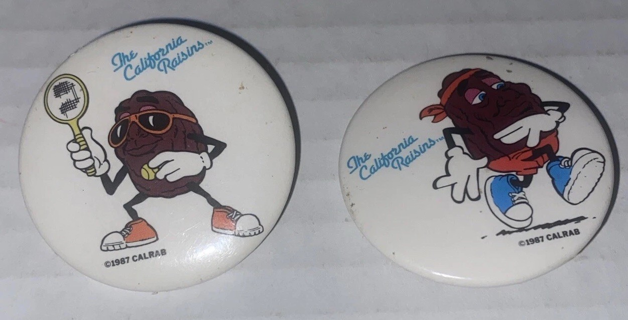 2 California Raisin Pinback Buttons Anthropomorphic Tennis Running VTG Applause