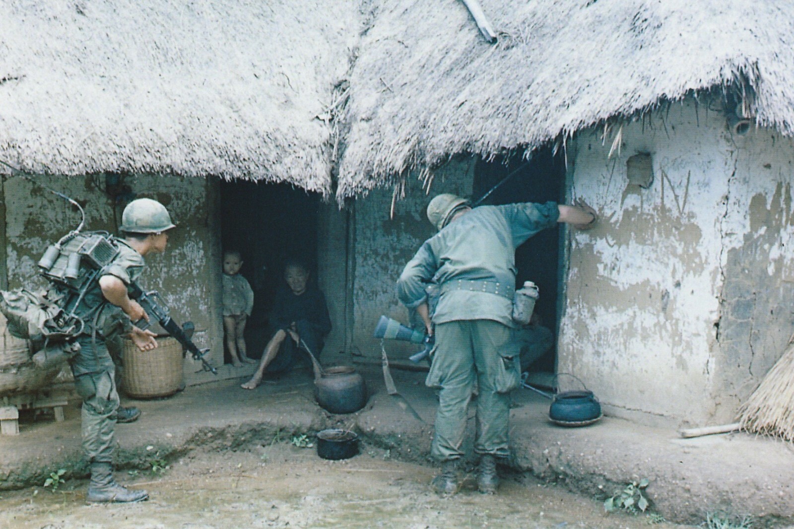 Vietnam War Photos -- Soldiers Seaching Village For Viet Cong Vietnam War Photos -- Soldiers Seaching Village For Viet Cong