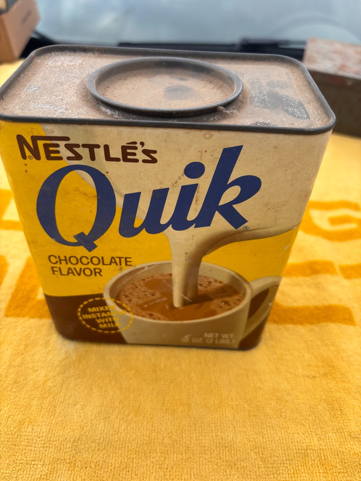 vintage 1960s-70s Nestle Quik Tin Mixes Instantly with Milk (yellow) - 32 Oz