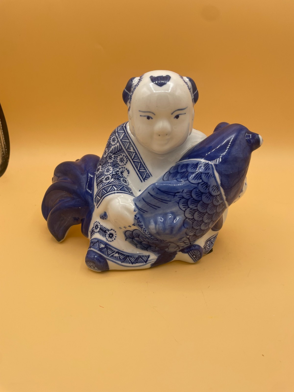 (325) Vintage Oriental Ceramic Statue Boy Holding Koi Fish in Cobalt Blue (325) Vintage Oriental Ceramic Statue Boy Holding Koi Fish in Cobalt Blue