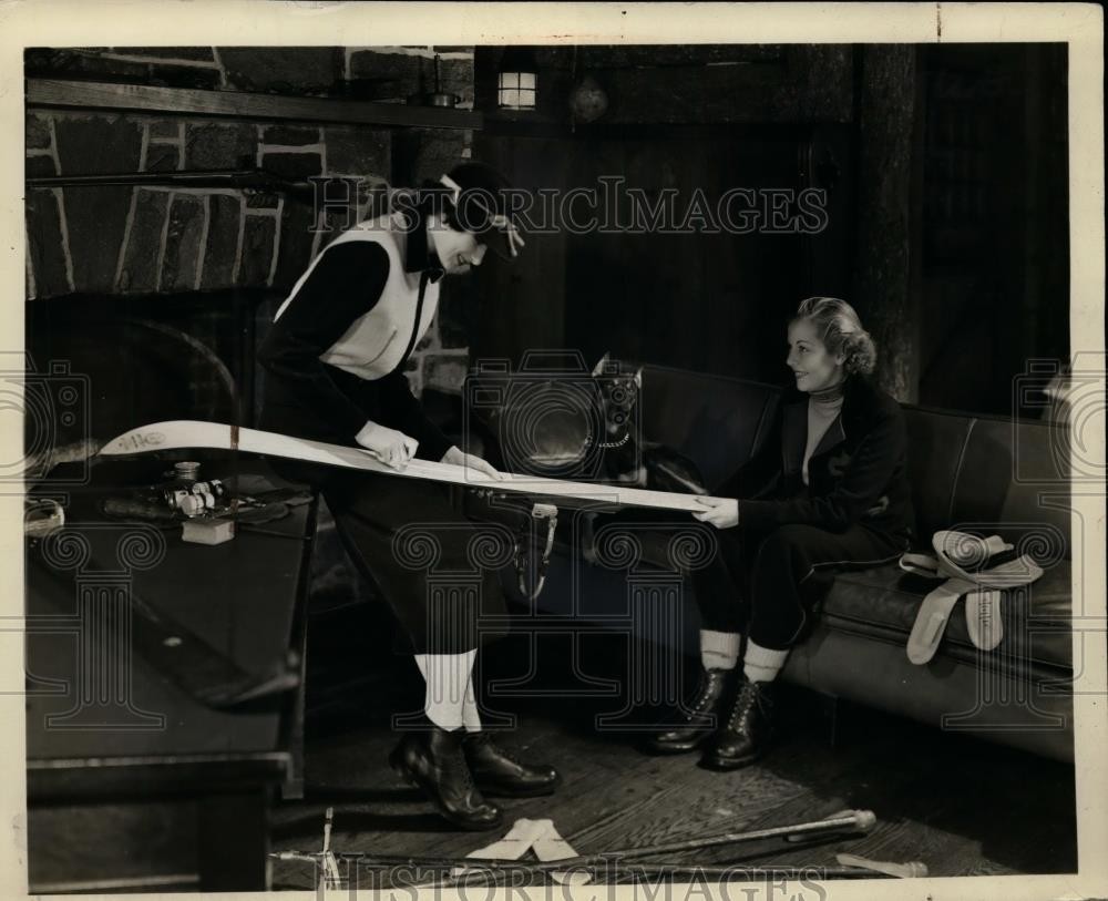 1937 Press Photo Skier working on keeping his skis in top condition - net08379