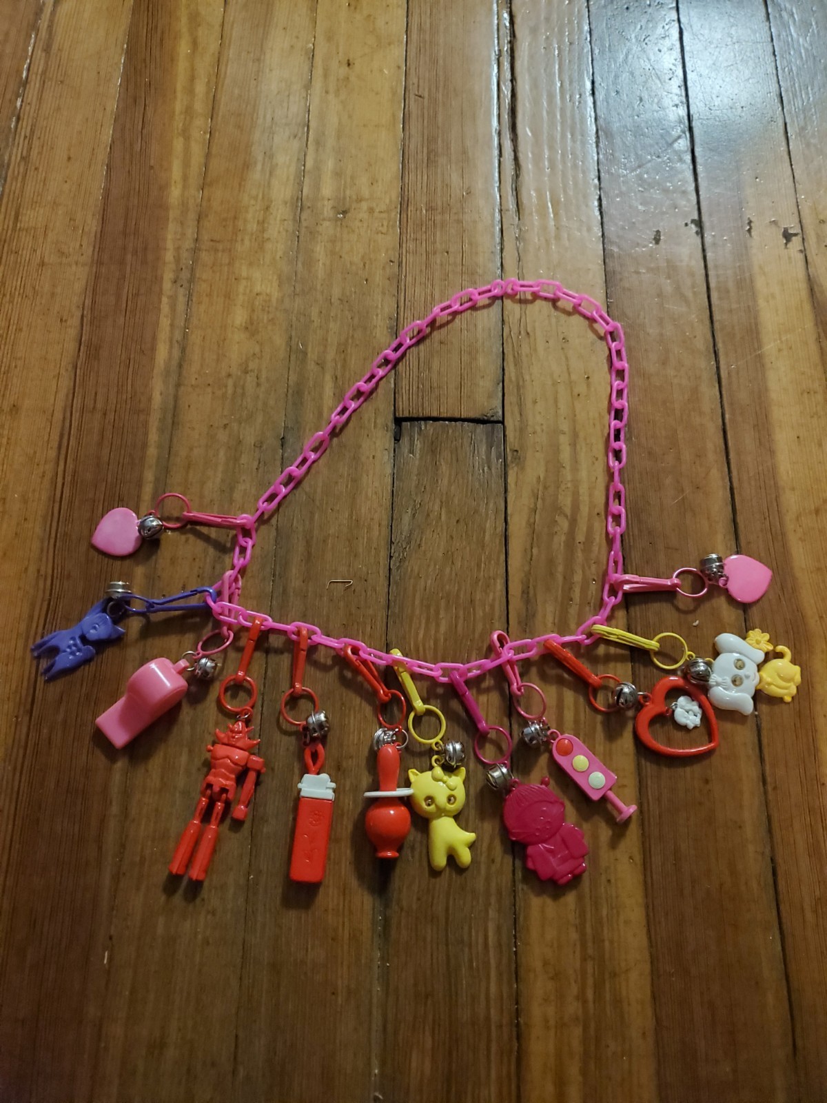 Vintage 1980s Plastic Bell Charm Necklace Pink W/ 12 Charms