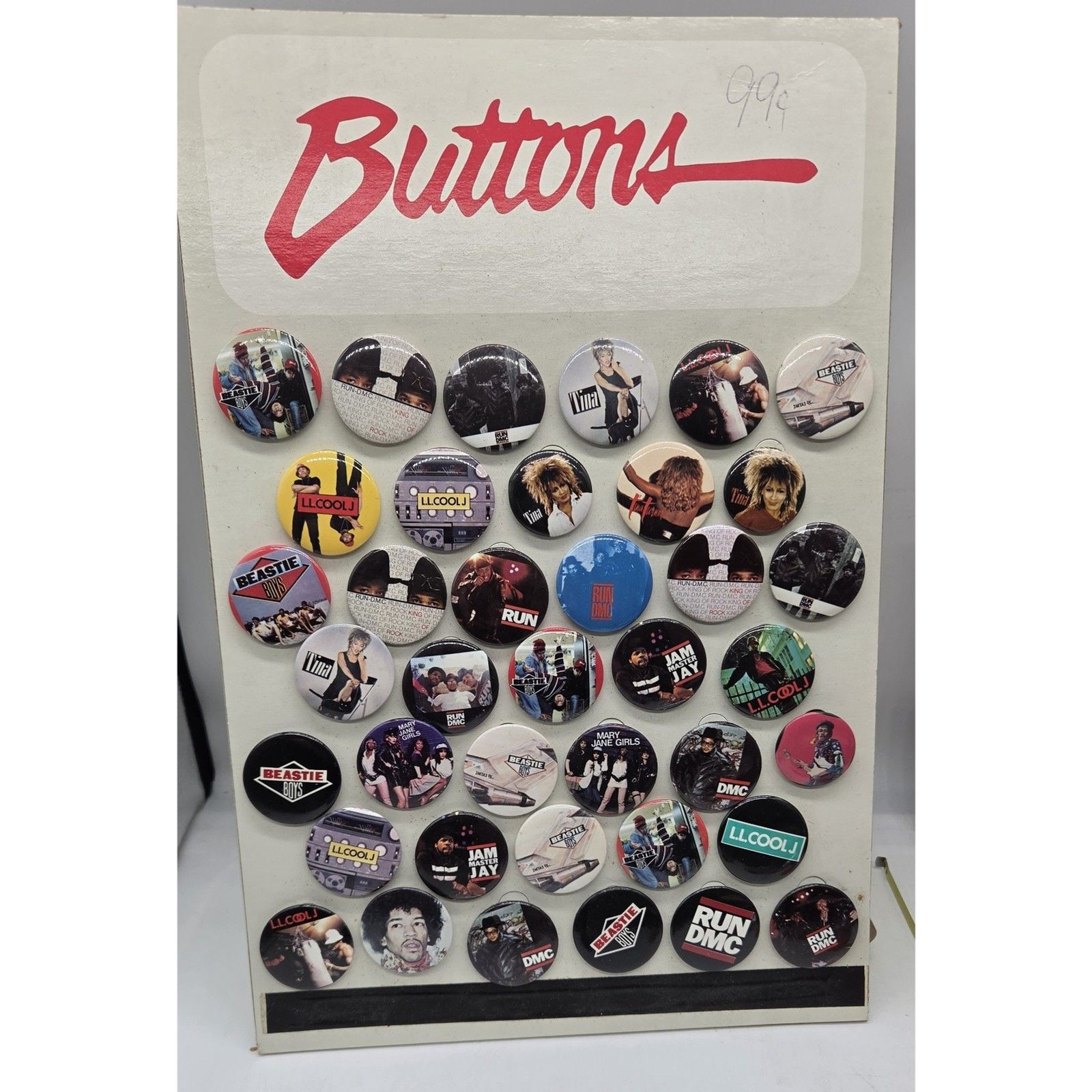 VINTAGE 1980S COUNTER DISPLAY RAP AND ROCK PINS BUTTONS (39) WITH STAND