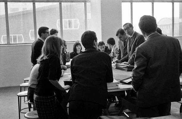 Young university students discussing a class room a student assemb- Old Photo Young university students discussing a class room a student assemb- Old Photo